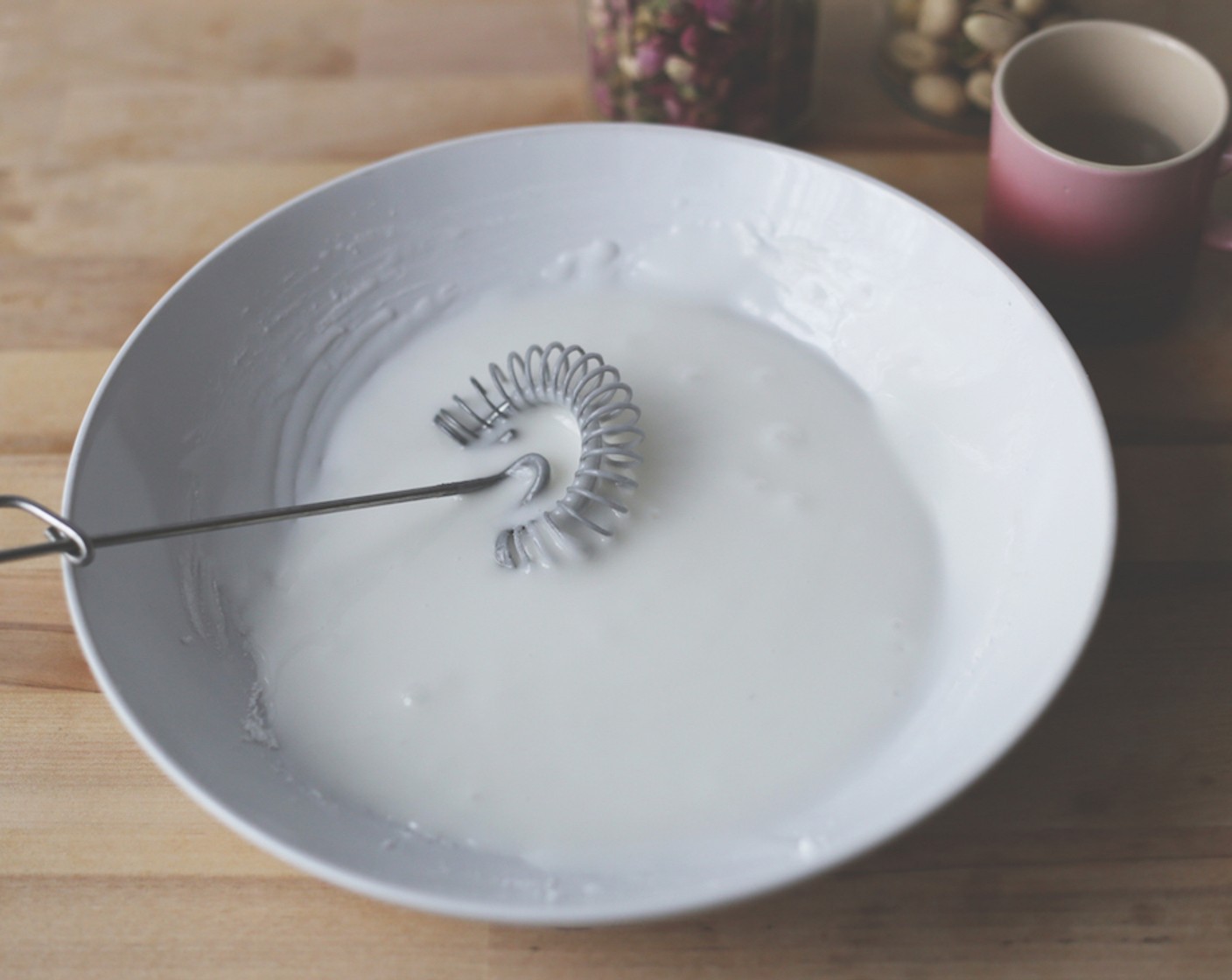 step 19 Slowly add Water (4 Tbsp) and mix until you get a smooth, thick glaze. Add the Rose Water (1/2 tsp) and mix to combine.