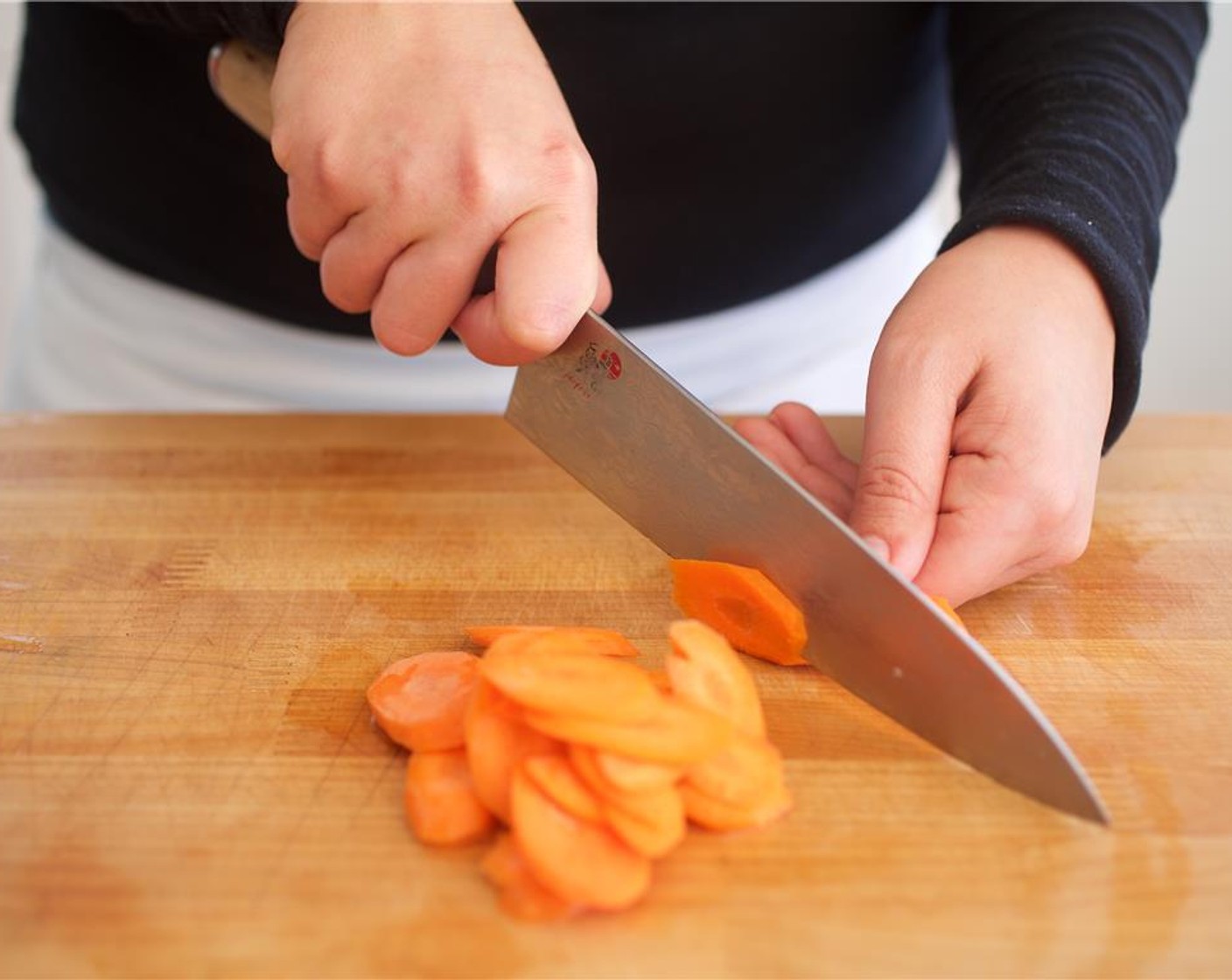 step 4 Bring four cups of water to a boil in a medium saucepan. Peel the Carrot (1) and slice thinly at a diagonal angle. Add to bowl with the yellow pepper. Slice the Cremini Mushroom (1 cup) in half and then into quartered pieces, and add to bowl. Remove stems if desired.