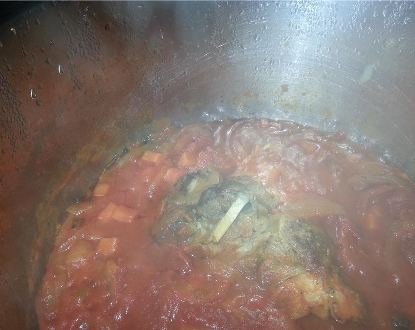 step 10 Remove the pork shoulder from the tomato sauce and cover in a large bowl or plate with aluminum foil. At this time, remove the sprigs of thyme and sage from the tomato sauce.