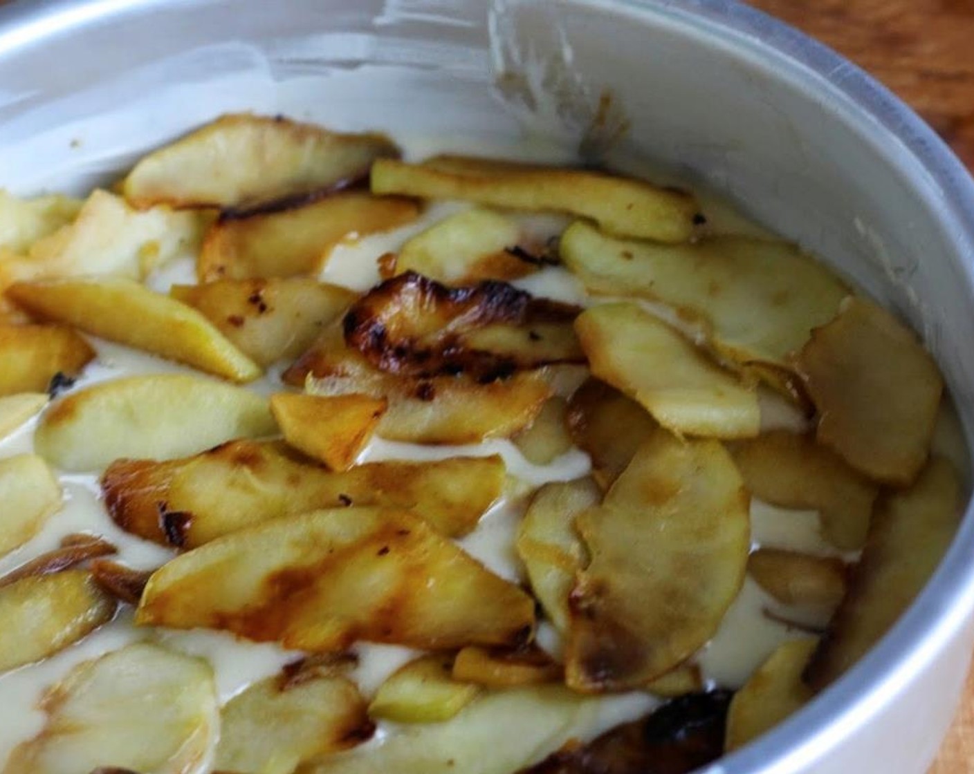 step 9 Whisk remaining All-Purpose Flour (2 Tbsp) into reserved batter. Spread this batter over the apples and batter in the pan. Sprinkle the remaining tablespoon of Granulated Sugar (1 Tbsp) evenly over the batter.