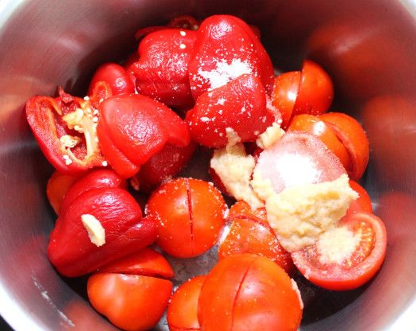 step 1 Add Tomatoes (10 cups), Red Bell Peppers (4 1/2 cups), and Onions (2) to a bowl.