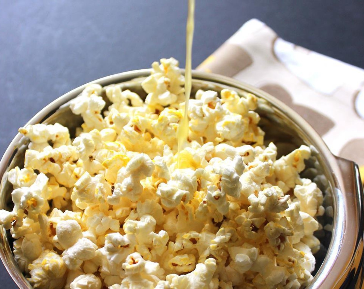 step 3 For Chili Lime Popcorn, zest the Limes (2), and combine the zest, Chili Pepper (1 tsp) and Salt (1/2 tsp). Coat the popped popcorn (4 cups) with Olive Oil (1 Tbsp) in a large bowl.