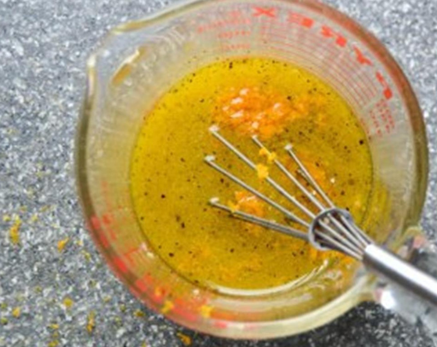 step 1 In a small bowl combine the zest of the Orange (1), Garlic (2 cloves), Dijon Mustard (1 Tbsp), Extra-Virgin Olive Oil (1/2 cup), Orange Juice (4 Tbsp), White Wine Vinegar (1 Tbsp), Honey (1 Tbsp), Kosher Salt (1/2 tsp), and Ground Black Pepper (1/4 tsp). Whisk until emulsified and set aside. (This makes more dressing than you’ll need for this salad. Save any extra for other salads.)