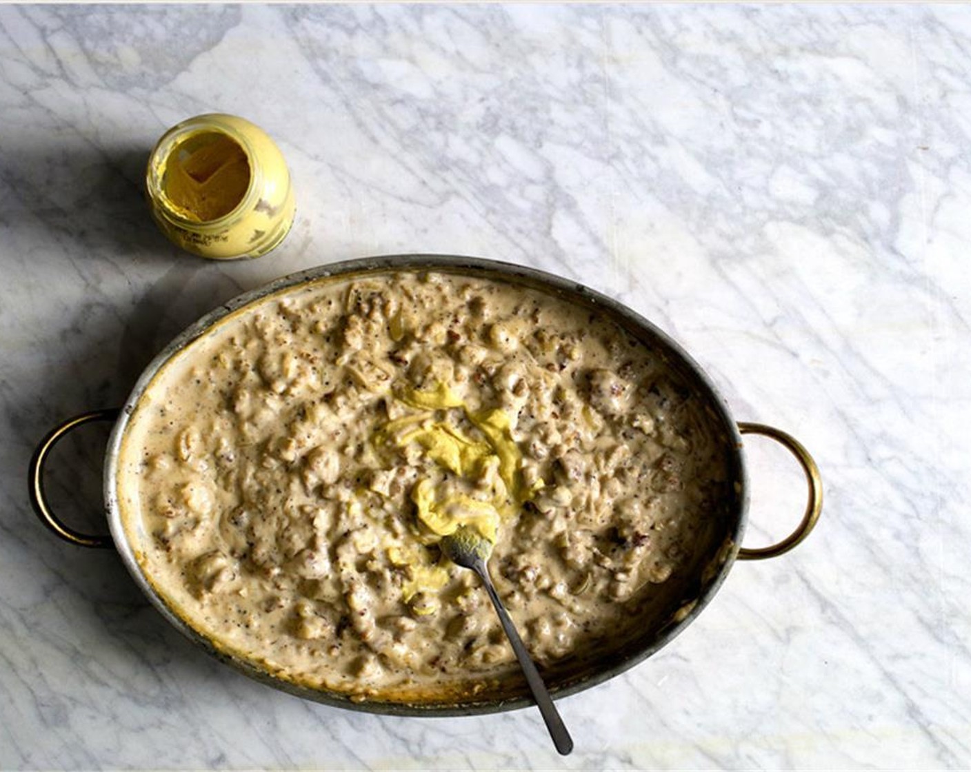 step 16 Preheat the oven on 500 degrees F (260 degrees C). Bring the gravy back to a simmer if needed (if the gravy seems too thick at this point, loosen with a bit more chicken stock), then mix in the Dijon Mustard (1 1/2 Tbsp).