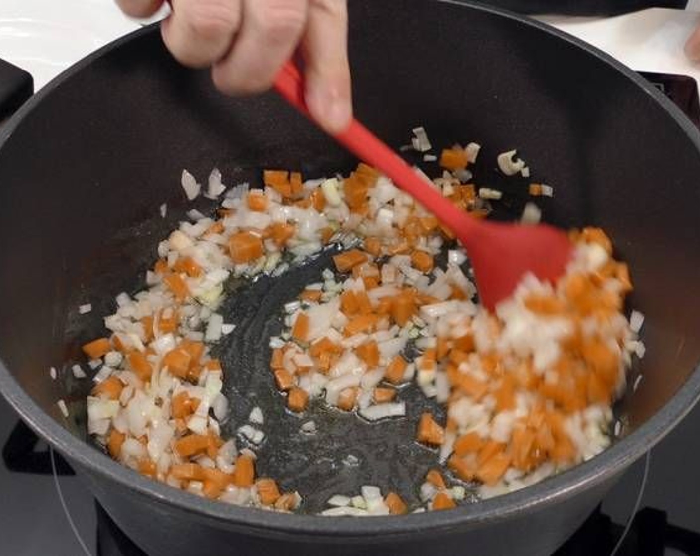 step 1 Place Garlic (4 cloves), Onion (1), and Carrots (2) in a large pot and sauté along with enough Olive Oil (as needed) to cover the bottom of the pan and a pinch of Salt (to taste).