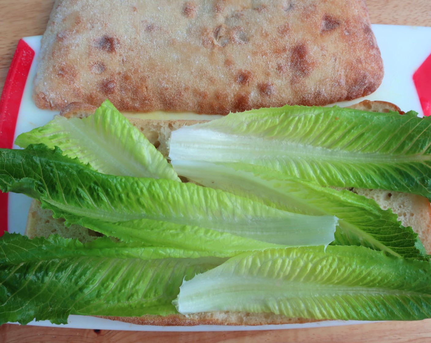 step 9 Cover bread with Romaine Heart (1 pckg).