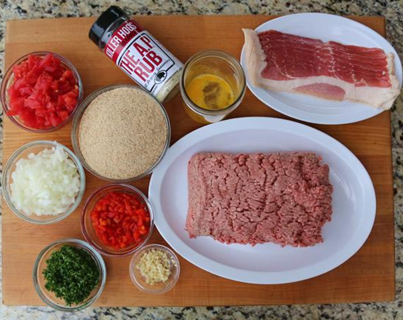 step 2 In a large bowl combine 80/20 Lean Ground Beef (2 lb), Breadcrumbs (2 cups), Onion (1 cup), Tomato (1 cup), Pimiento Pepper (1/4 cup), Fresh Parsley (1/4 cup), Garlic (2 cloves), Egg (1), and All-Purpose Spice Rub (1 Tbsp).