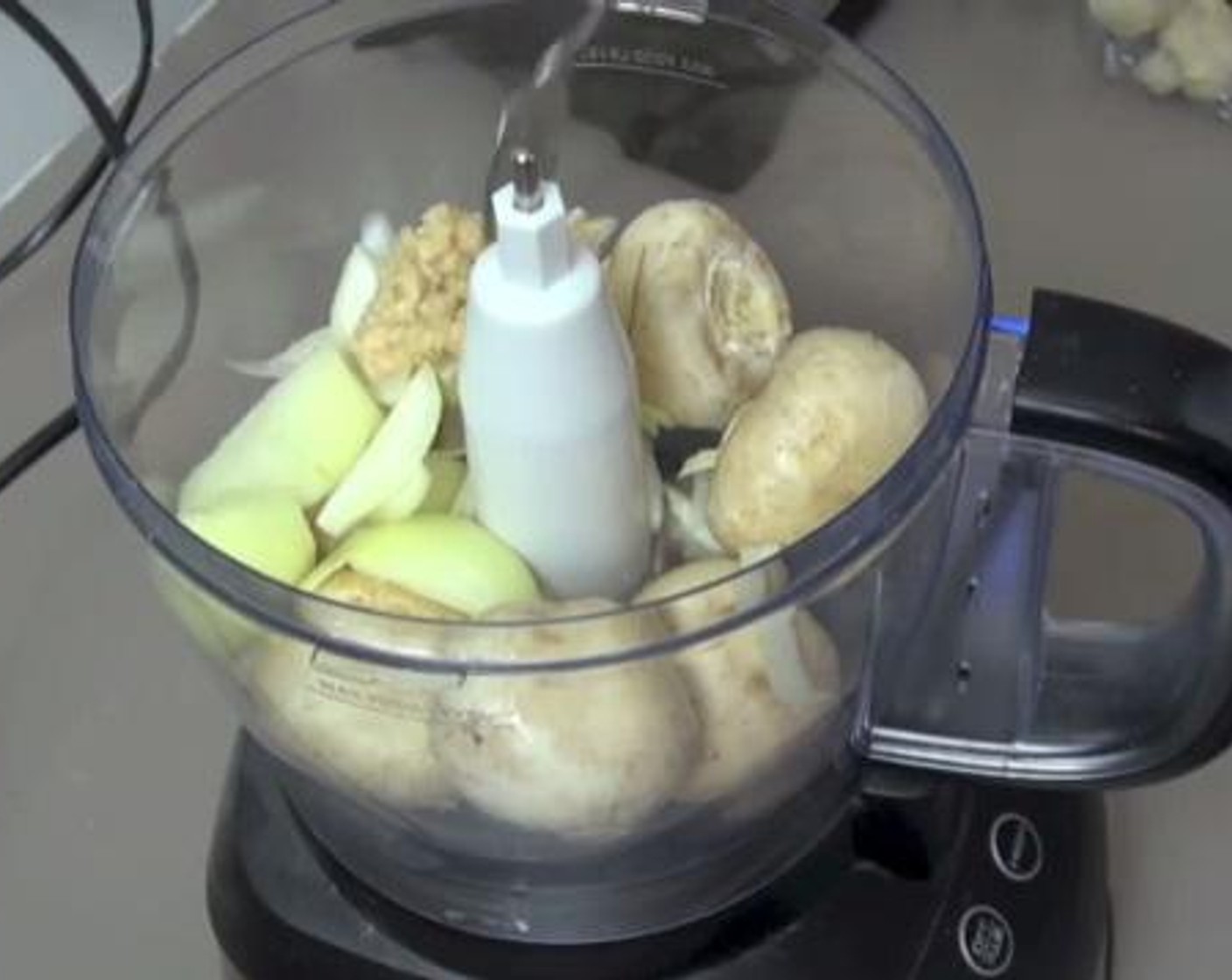 step 1 Into a food processor, pulse up the Button Mushrooms (2 cups), Yellow Onion (1), and Garlic (2 cloves). Set aside while you are working on the beef.