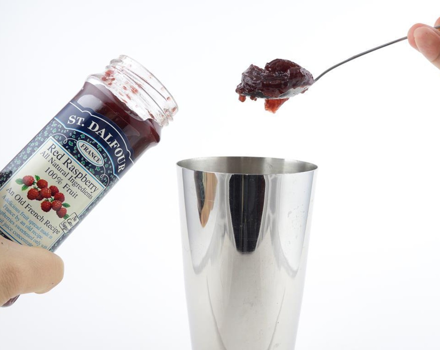 step 2 Pour Raspberry Jam (1 tsp) and Orange Juice (3 fl oz) into the cocktail shaker.