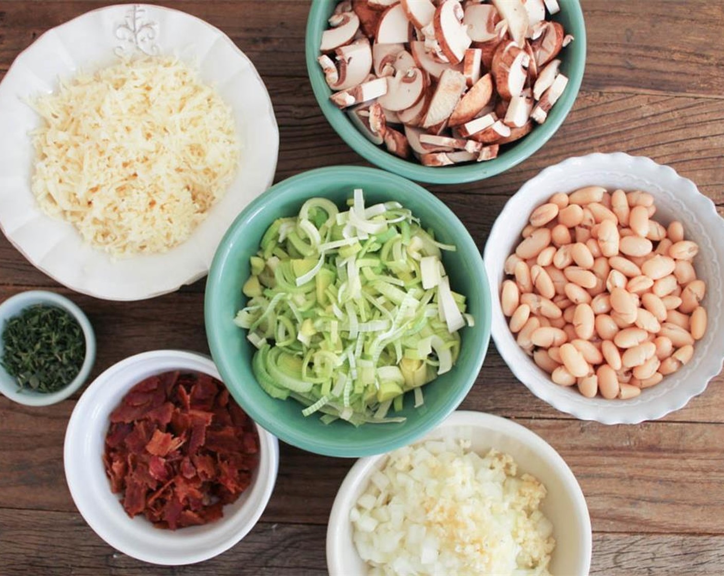 step 6 Meanwhile, prep other ingredients. Slice the Leeks (2), Shiitake Mushrooms (1 1/2 cups), and Cremini Mushrooms (1 1/2 cups).