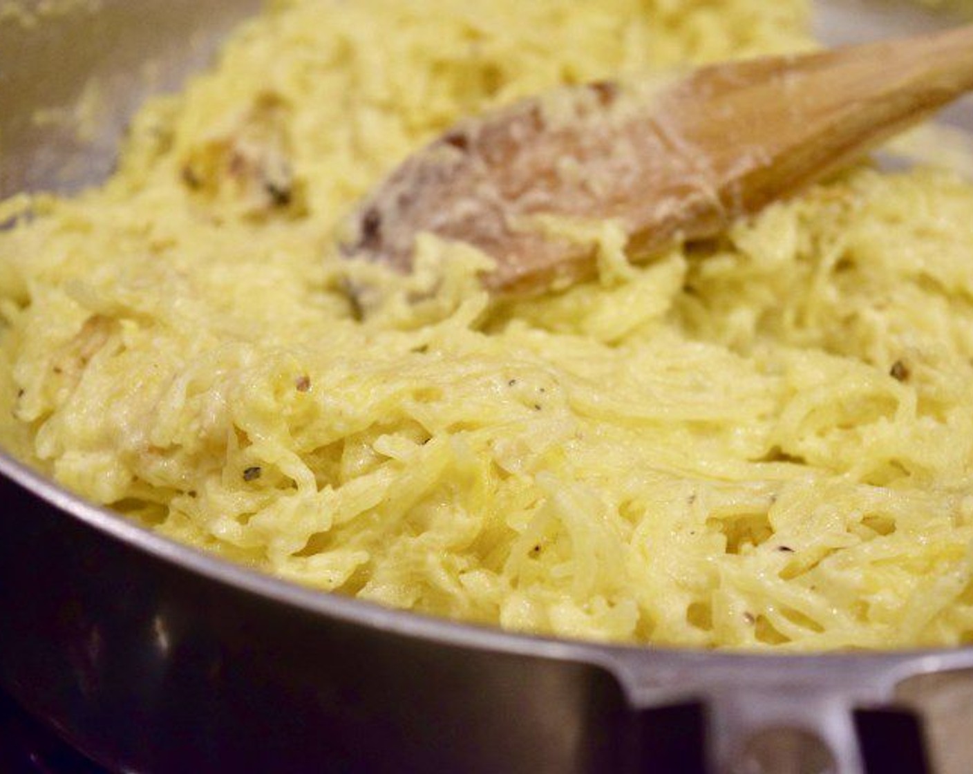 step 9 With a fork, fluff up the squash and add it to the saucepan. Gently fold into the sauce. If you like, top with extra Parmesan, or for some heat, Crushed Red Pepper Flakes (1 pinch).