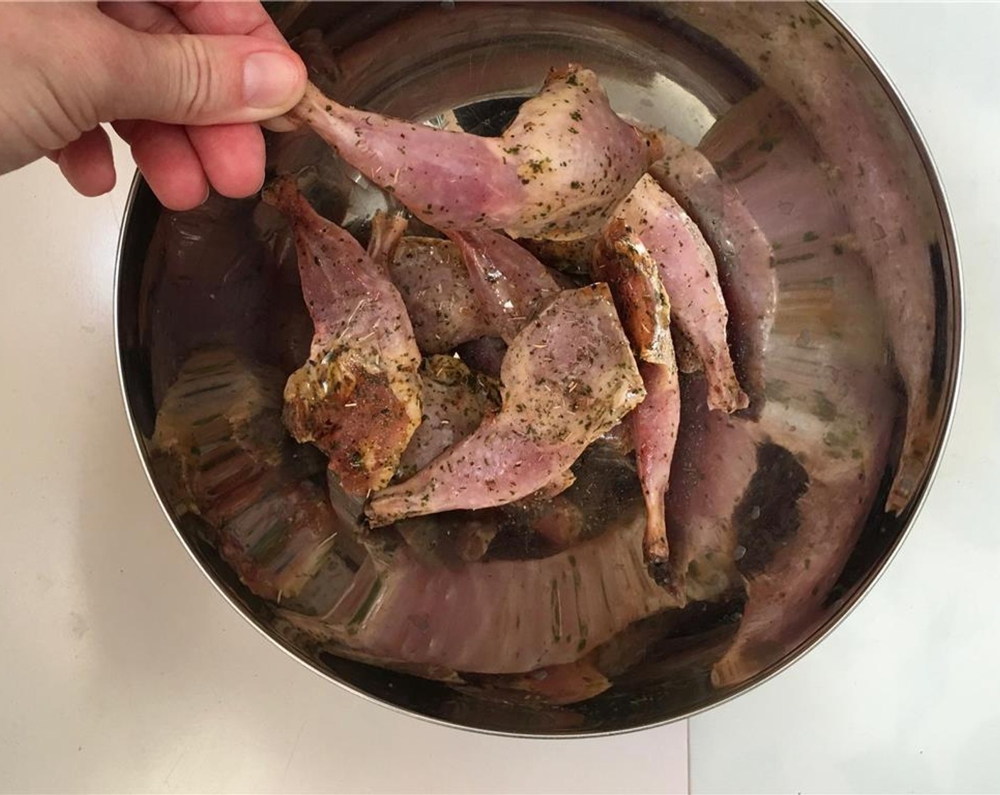 step 1 Transfer Quail Legs (10) to a mixing bowl and add Olive Oil (2 Tbsp) and Dried Thyme (1/2 tsp). Season with a pinch of Salt (to taste) and Ground Black Pepper (to taste).