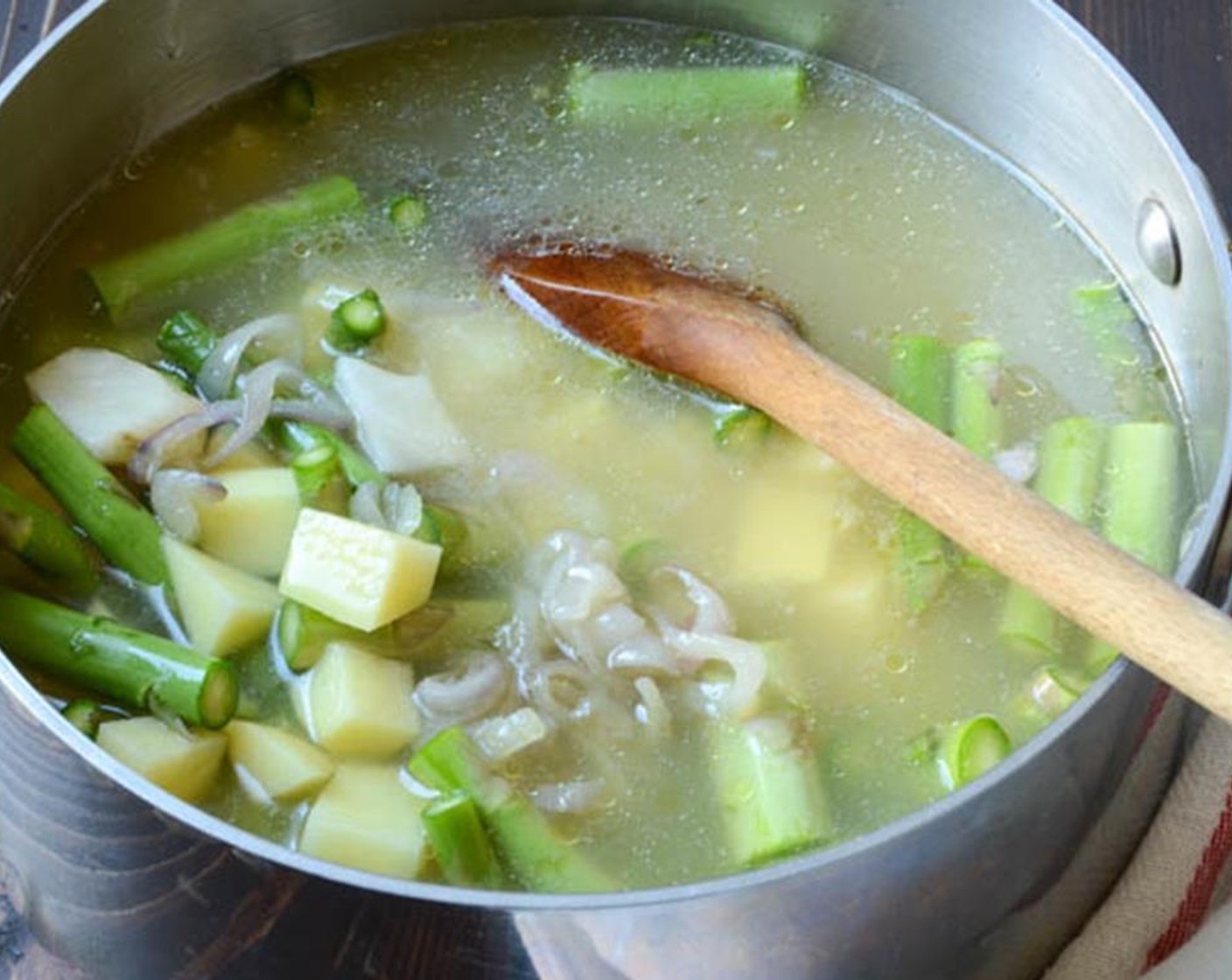 step 5 Add the asparagus, potato and sun chokes to the shallots. Add Low-Sodium Vegetable Broth (3 cups), cover and bring just to a boil. Turn down the heat to simmer and cook for 20 minutes until vegetables are tender.