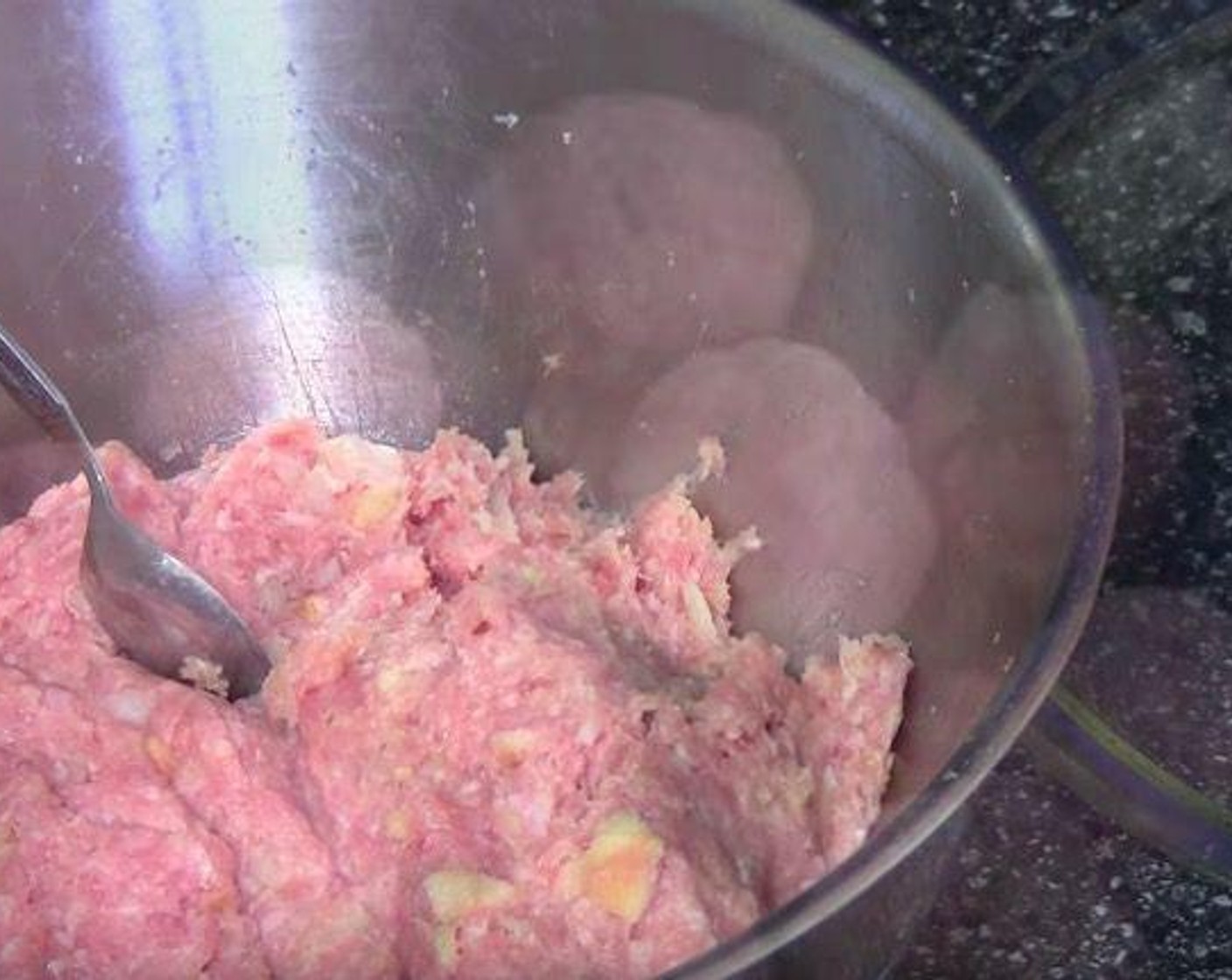 step 1 Add Pork (1.7 lb), Onion (1), Breadcrumbs (1 cup), and Egg (1) into a mixing bowl and mix it together. Take a teaspoonful of mixture and roll a ball by hands. Continue with the rest.