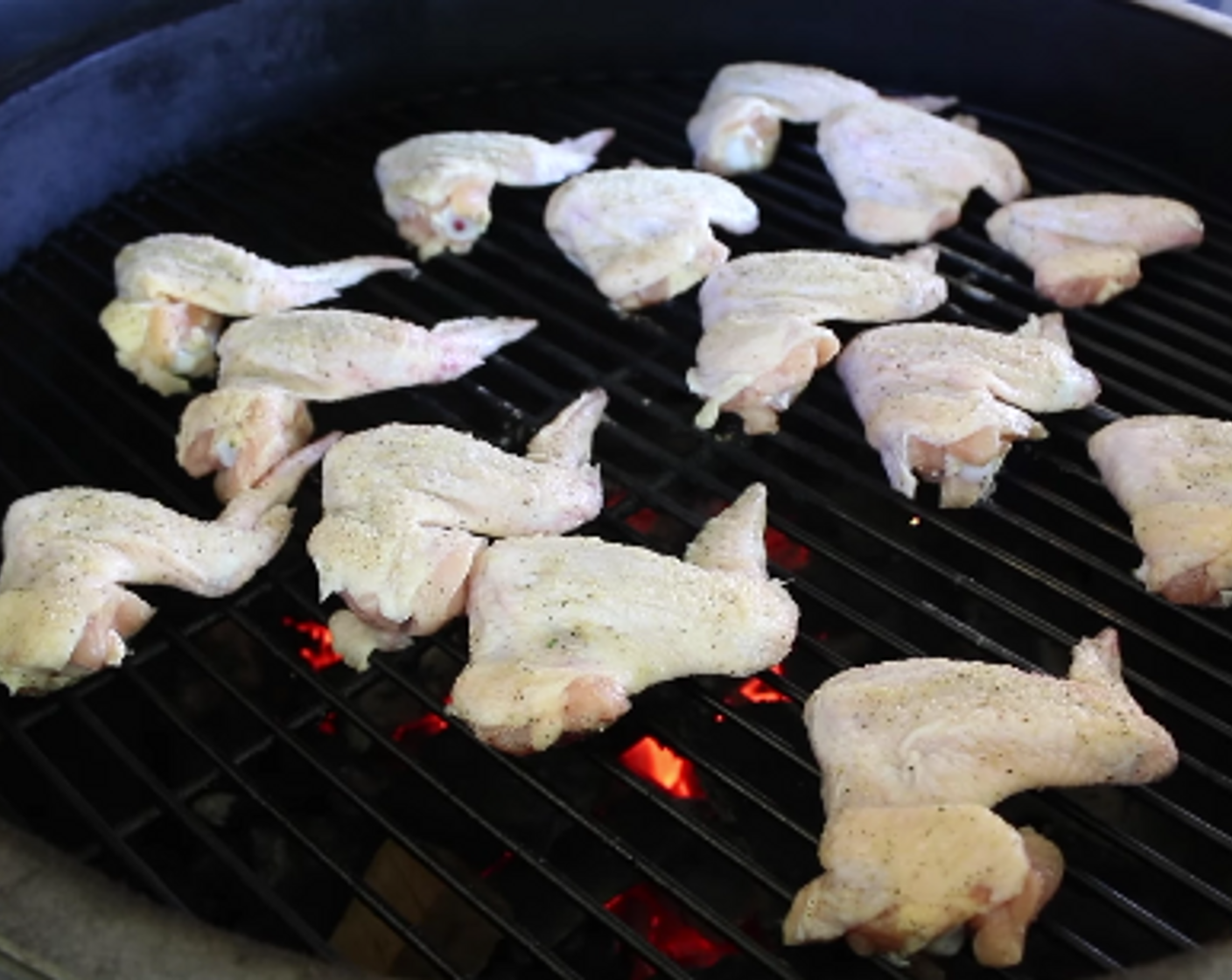 step 4 Arrange wings on cooking grate directly over hot coals. Adjust the grill vents so that temperature remains constant at 325 degrees F (160 degrees C).