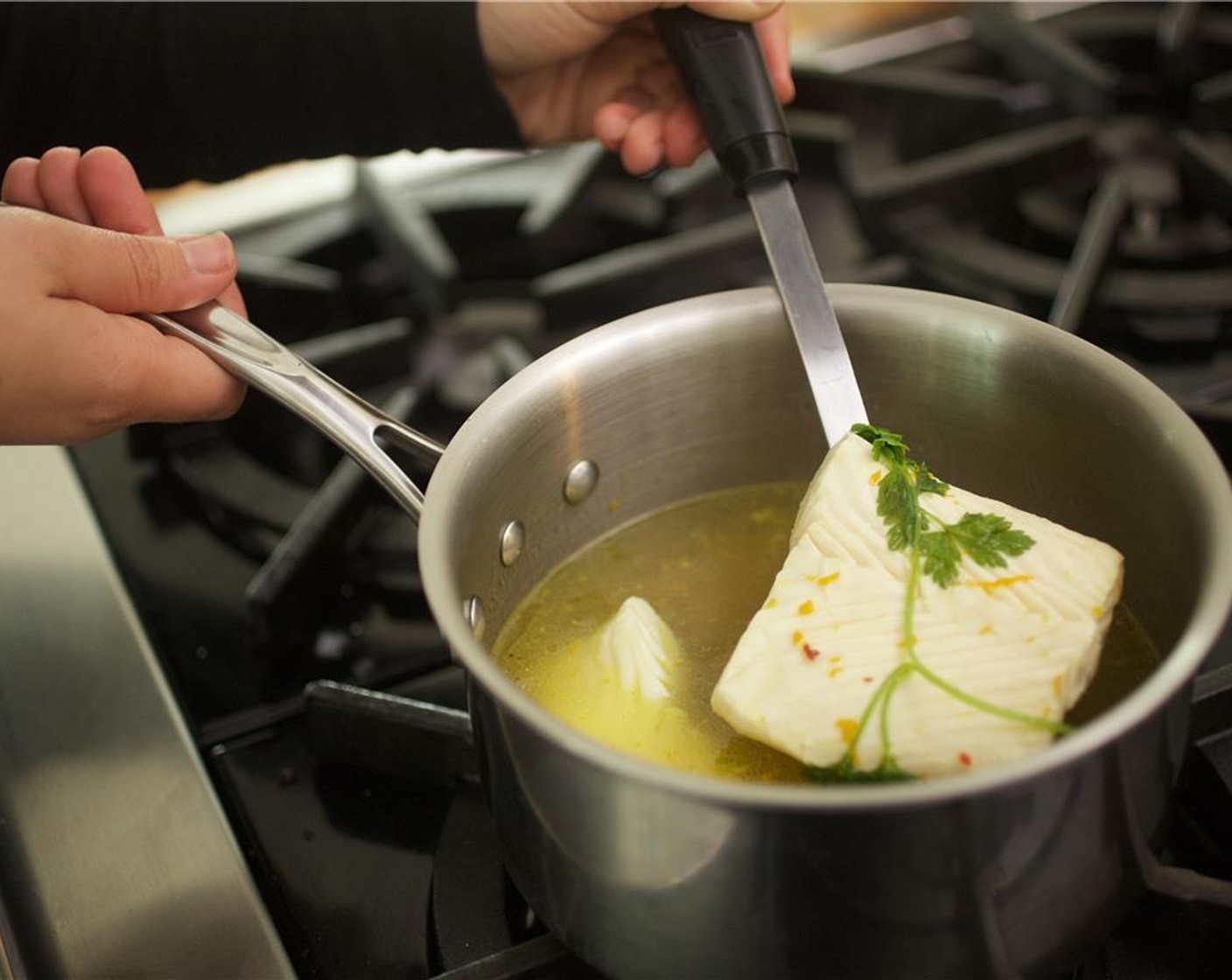 step 11 Pat Halibut Fillets (2) dry with paper towels. Add fish to the simmering pot and cook for five minutes until cooked through.