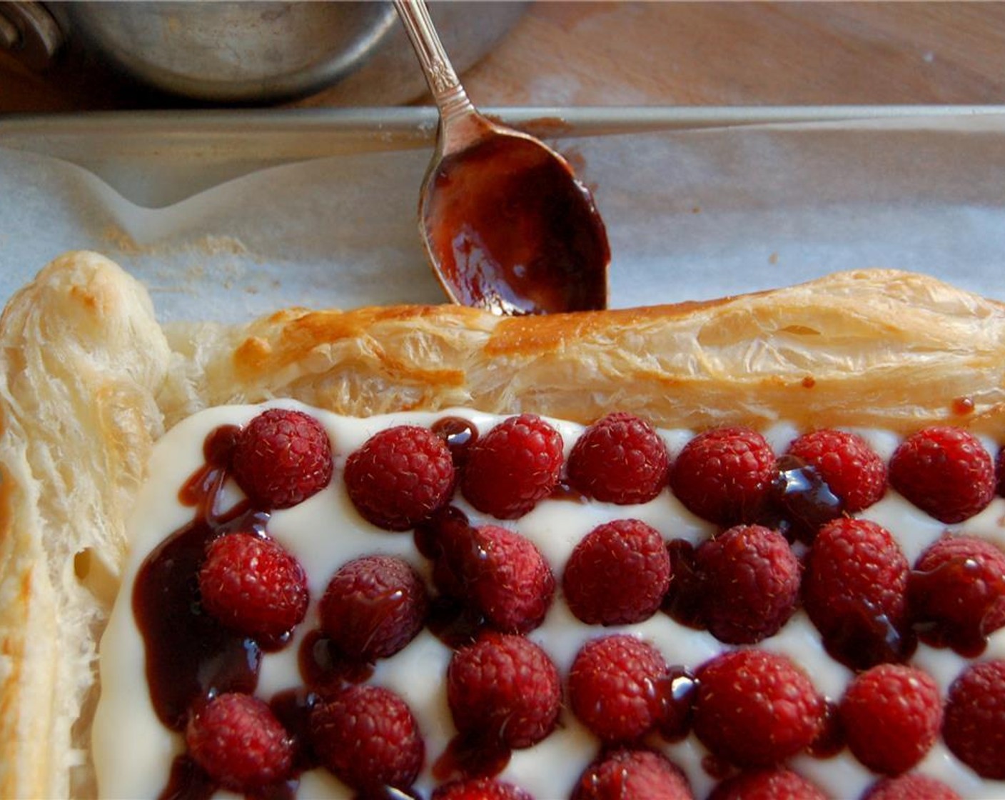 step 9 Warm the Just Jan’s® Seedless Raspberry Spread (1/4 cup) and drizzle over the raspberries.