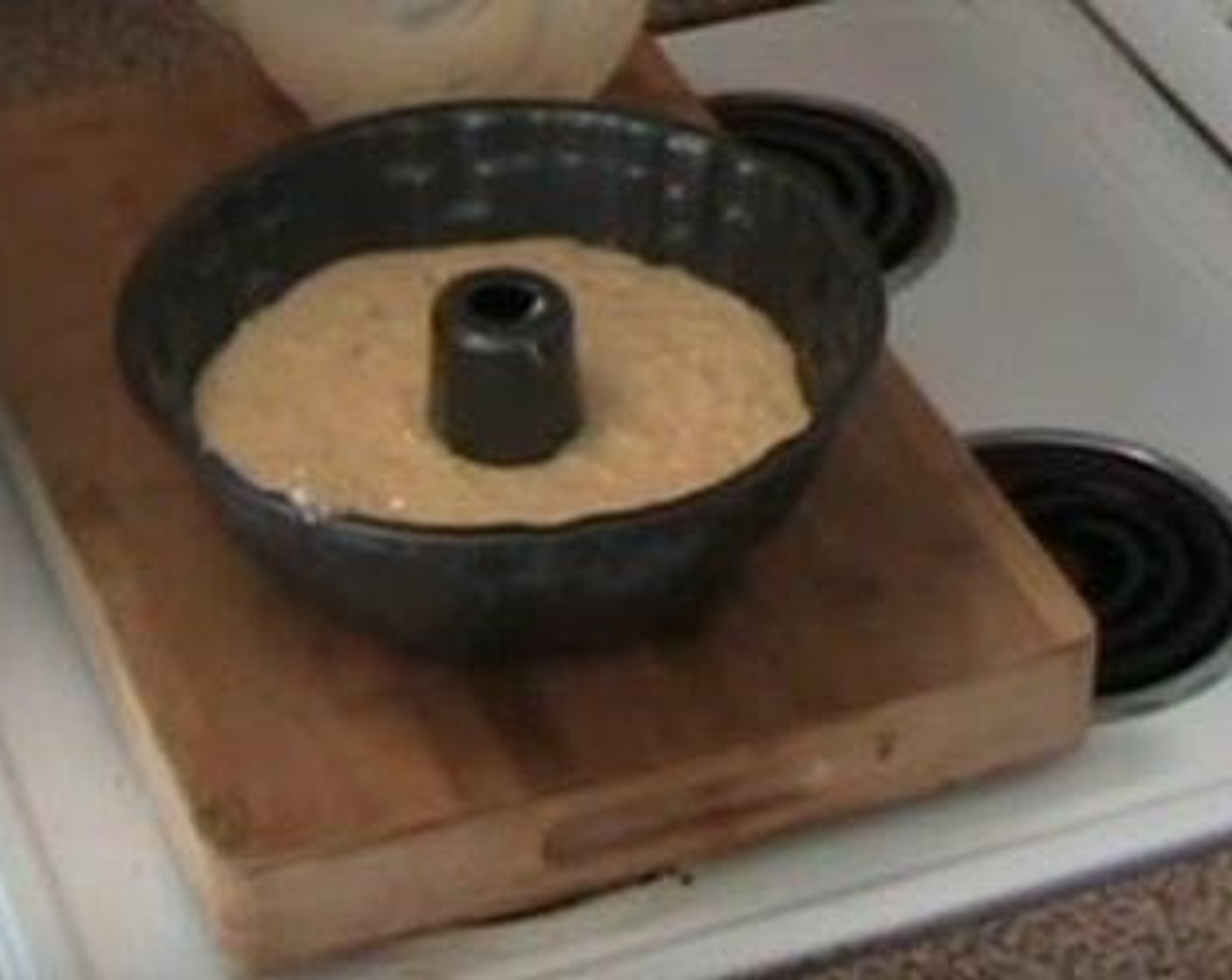 step 2 Pour the cake batter into a ring tin. Bake at 180 degrees C (350 degrees F) for 45 minutes.