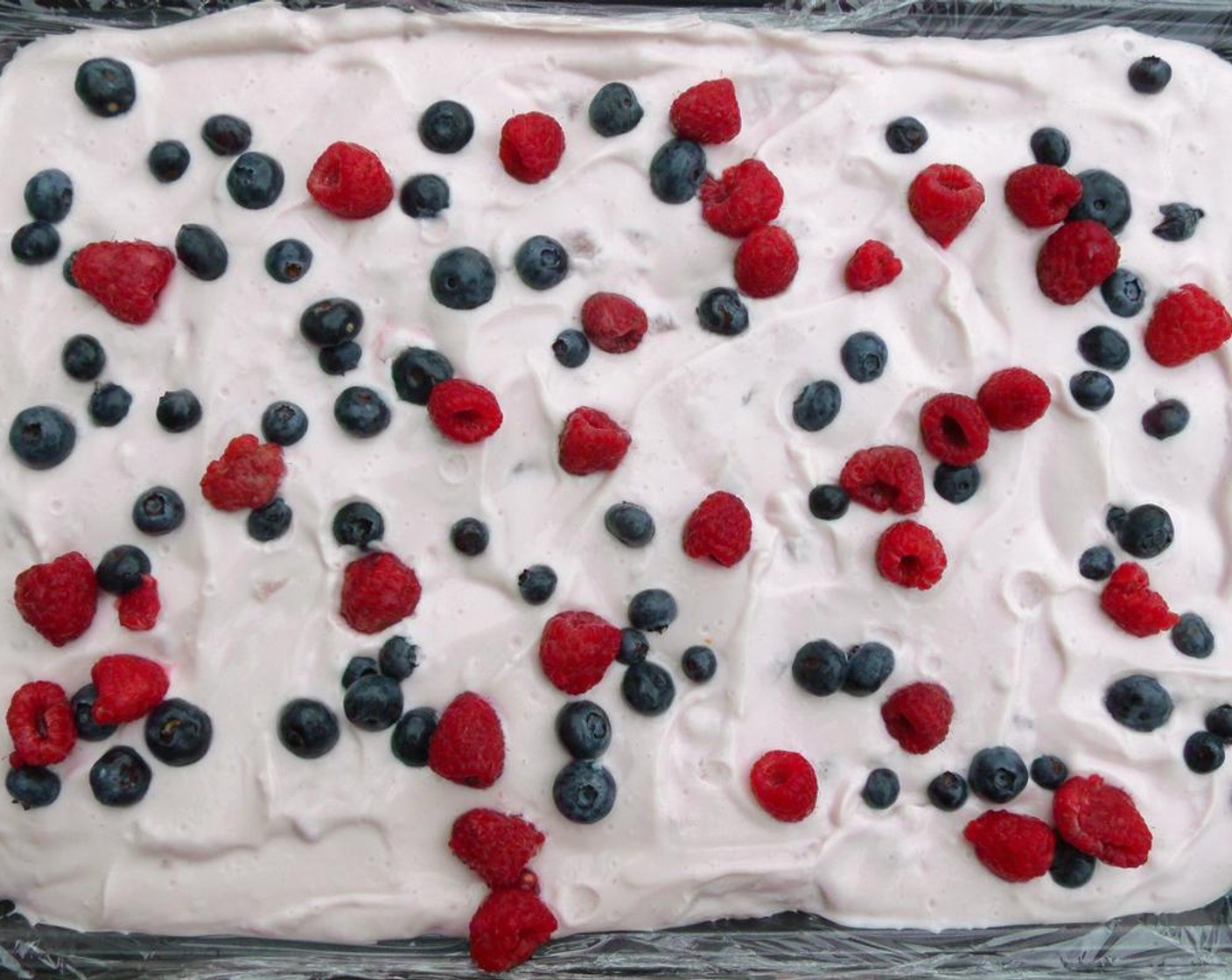 step 6 Sprinkle Fresh Raspberries (2 cups) and Fresh Blueberries (2 cups) evenly on the strawberry yogurt.