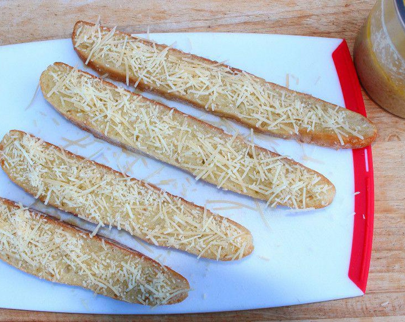 step 3 Sprinkle with grated asiago cheese, saving some for the spinach.