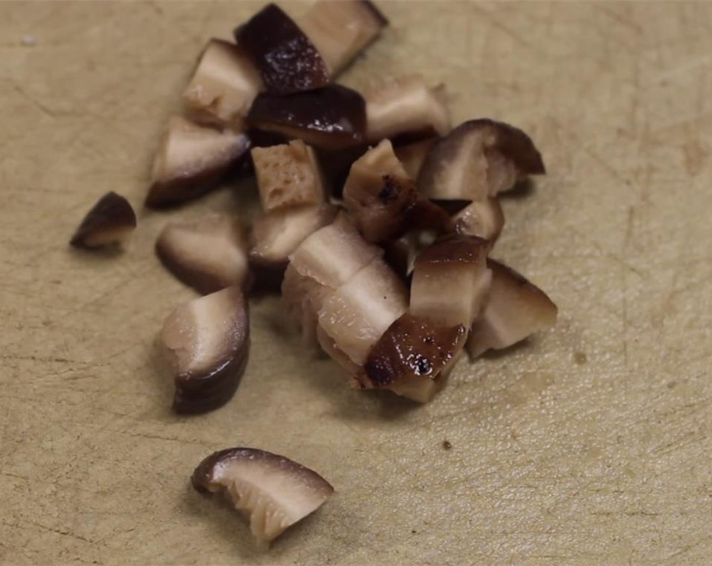 step 10 Cut the soaked shiitake mushrooms into small pieces.