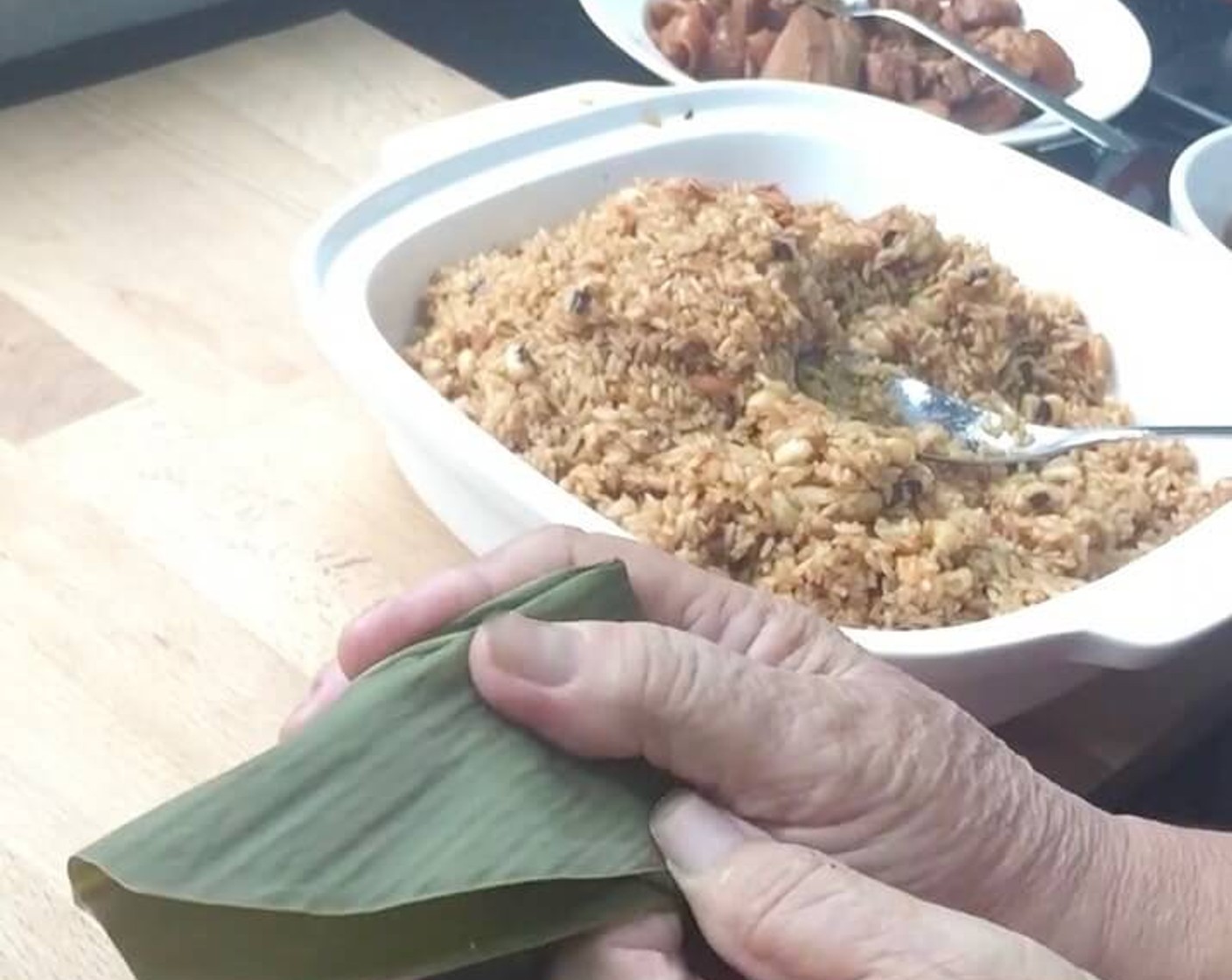 step 35 At the top of the triangle (base end of the leaves), fold over the ends either to the right or left, making sure the rice dumpling is firmly wrapped.