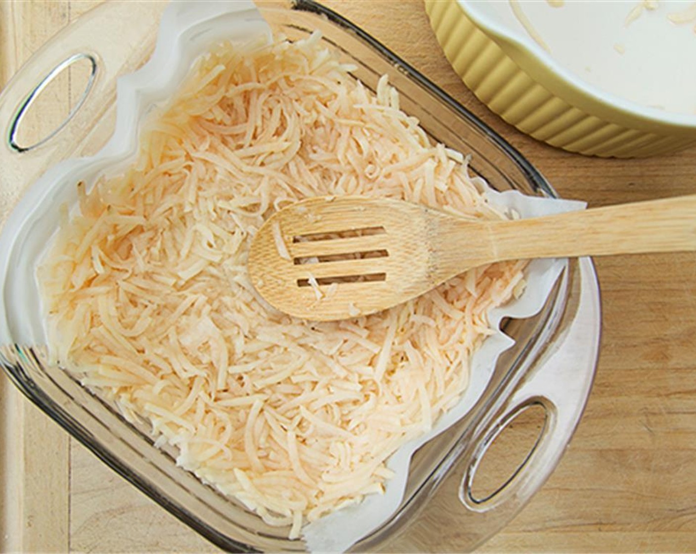 step 2 Combine grated raw Potatoes (2 cups), Onion (1/4 cup), Salt (1/2 tsp) and Egg (1) in a small bowl and mix well. Transfer to the pie pan and pat into place with fingers with a little flour on them, building up the sides into a handsome edge. Bake for 30 minutes.