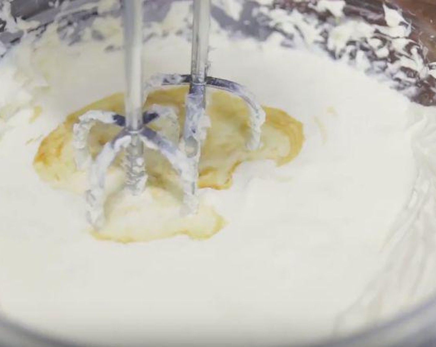 step 6 To make the cheesecake filling: In a bowl, add Cream Cheese (1 1/2 cups), Granulated Sugar (1/2 cup) and Lemon (1/2). Cream together until is smooth and fluffy. Add Heavy Cream (1 cup) and Vanilla Extract (1/2 tsp) and mix until the mixture thickens. Fold in Lemon (1) cover it and refrigerate until ready to use.
