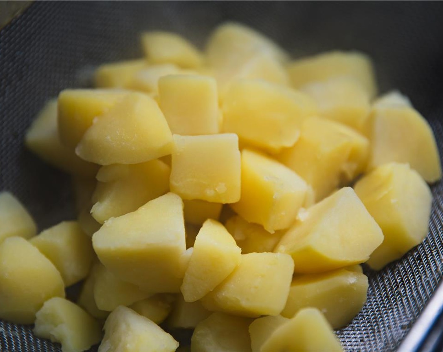 step 3 When potatoes are done, drain in a colander in a sink.