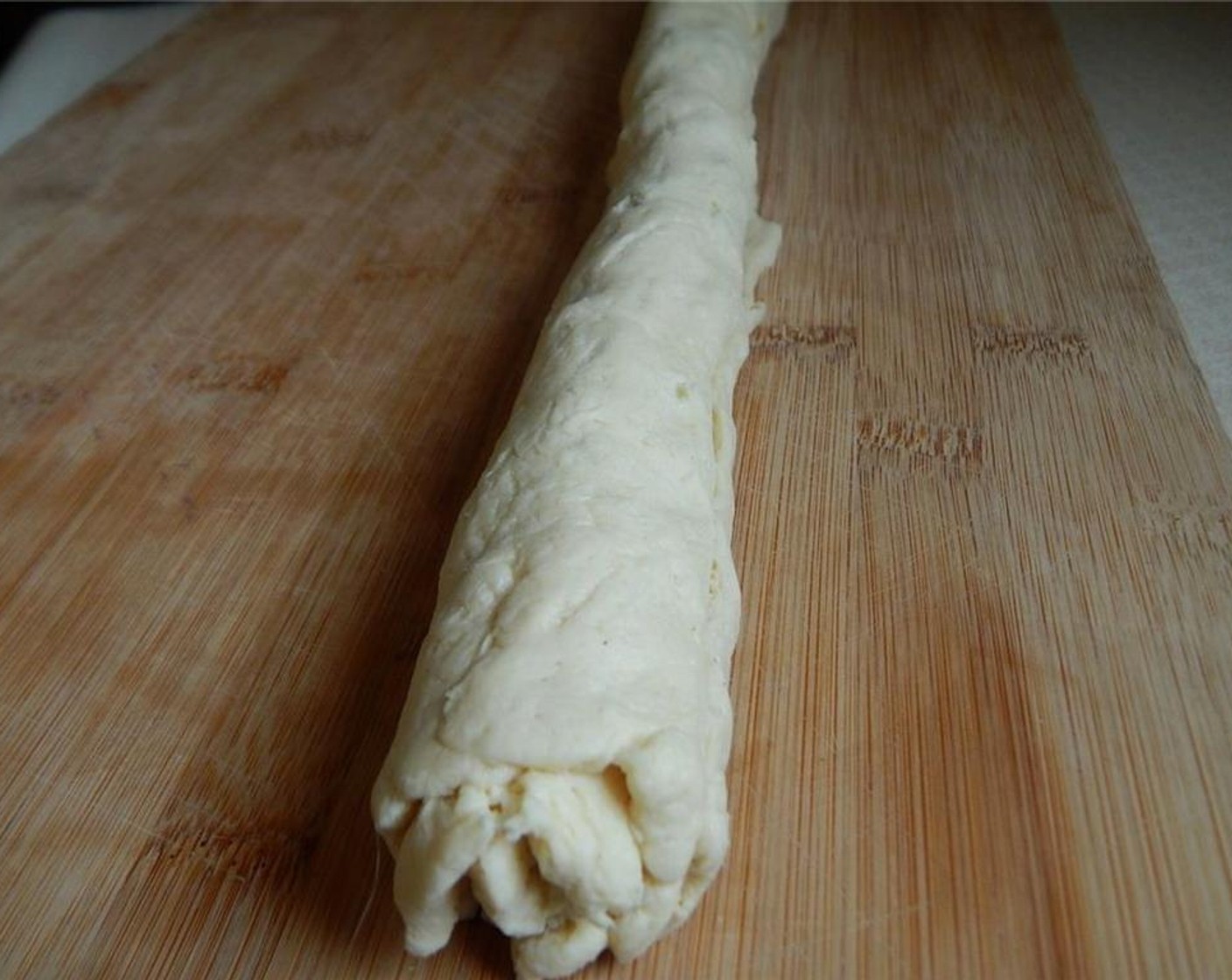 step 4 Carefully roll up your dough so you have a long roll.