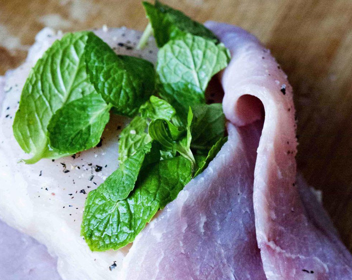 step 3 Wrap the chicken with the Pork Shoulder (4 slices) and place some Fresh Mint (to taste) in between.