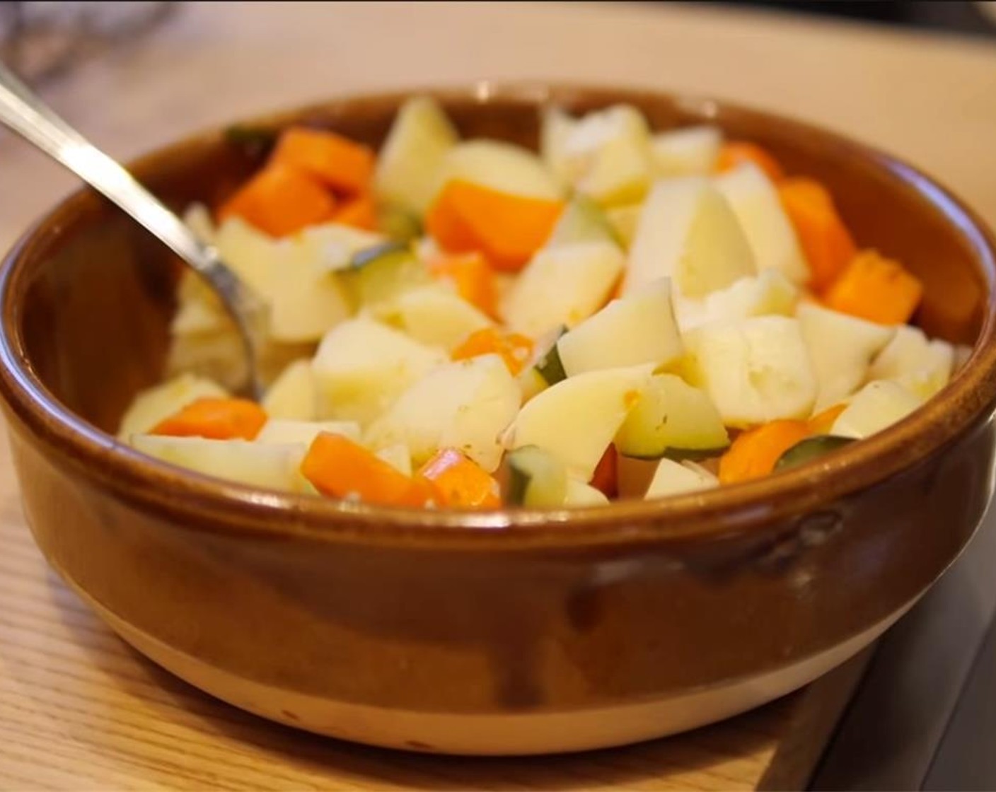 step 2 Put russet potatoes, zucchini, and carrot into a bowl, and mash with a fork. Season with some Salt (to taste) and Ground Black Pepper (to taste). Heat a nonstick pan on the stove top with some Vegetable Oil (as needed).