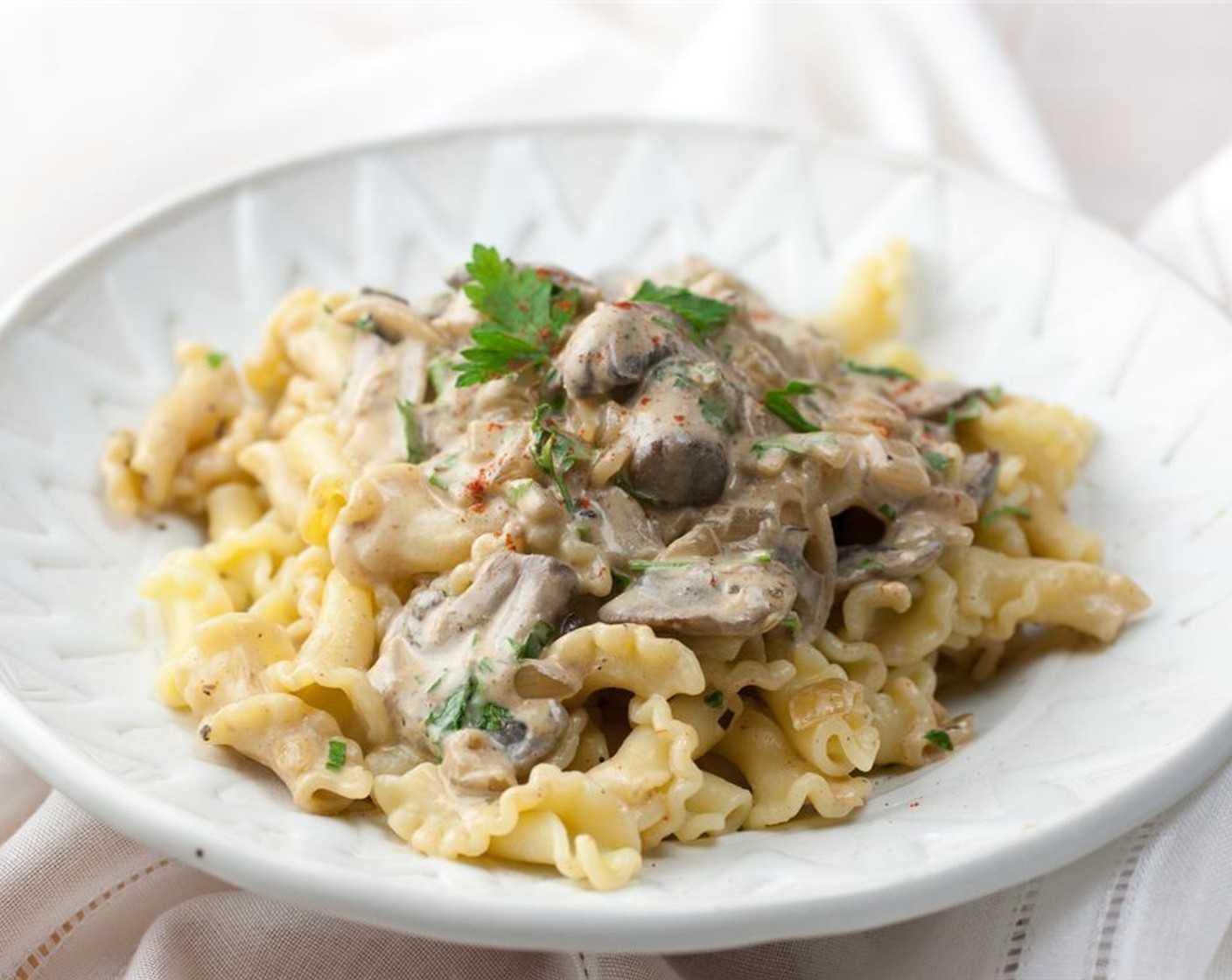 step 5 You can serve this stroganoff two ways. Either add in the pasta and Fresh Parsley (1/2 cup) to the mushrooms and toss to coat, or serve the mushroom mixture over the pasta and sprinkle parsley on top.