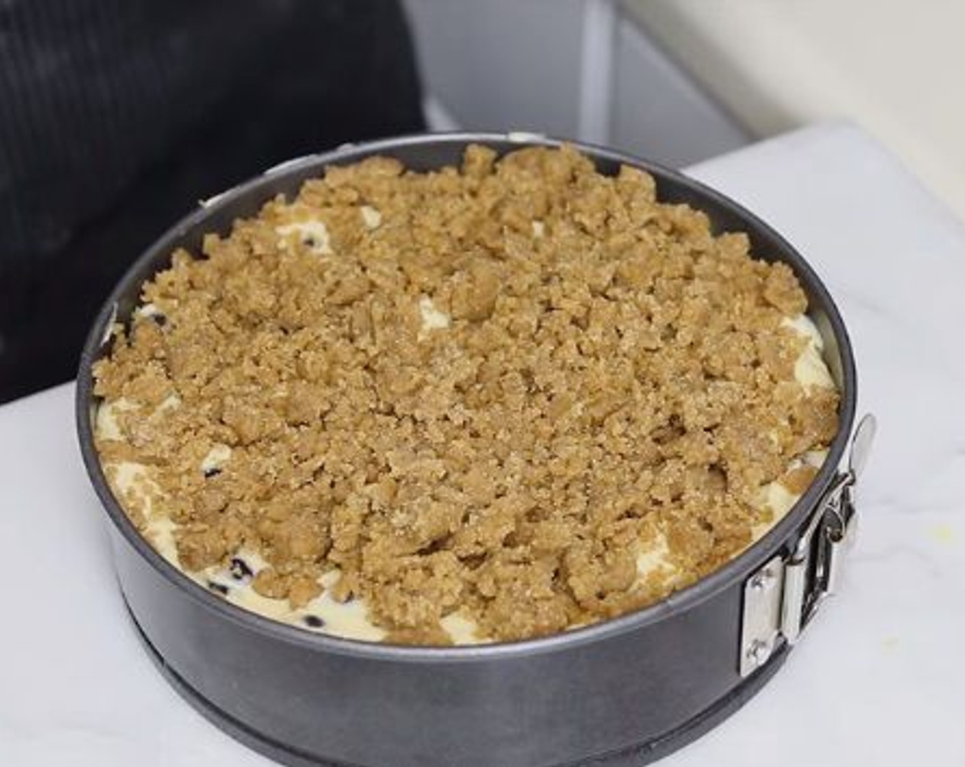 step 7 Sprinkle the crumb topping all over the batter, bake for 50 minutes or until it’s fully cooked through.