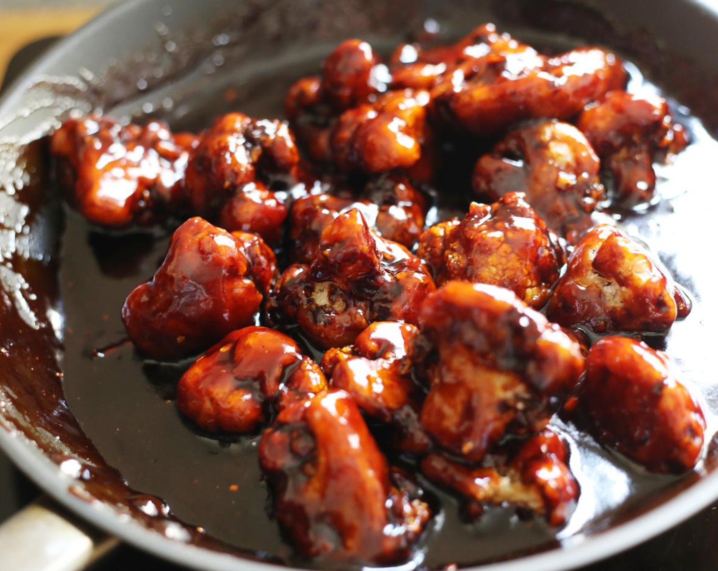 step 12 Working again in batches, quickly add the deep fried cauliflower to the sauce and toss well.