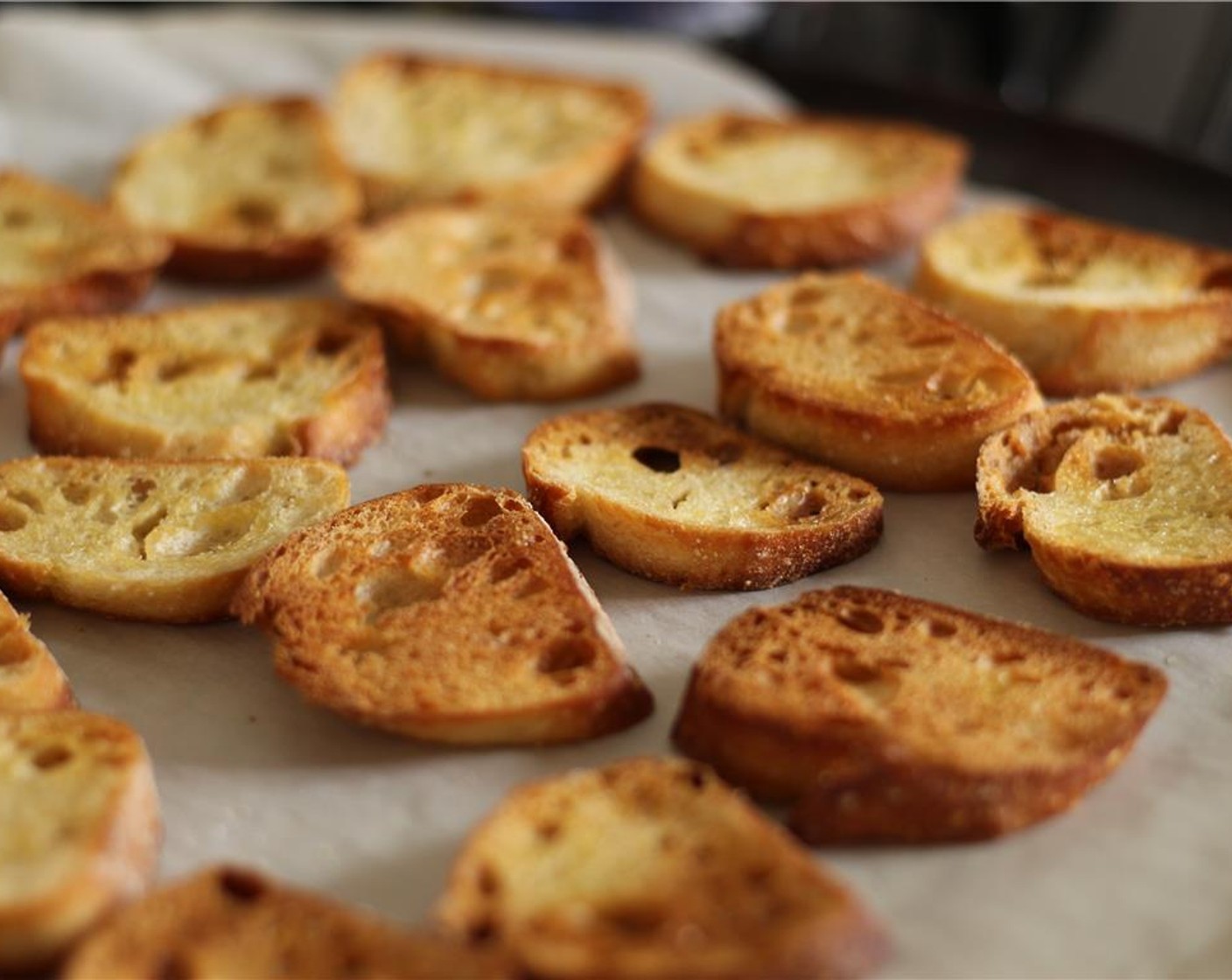 step 2 Brush the bread slices with divina Olive Oil (2 Tbsp). Place in the preheated oven and bake for 10 minutes until golden.