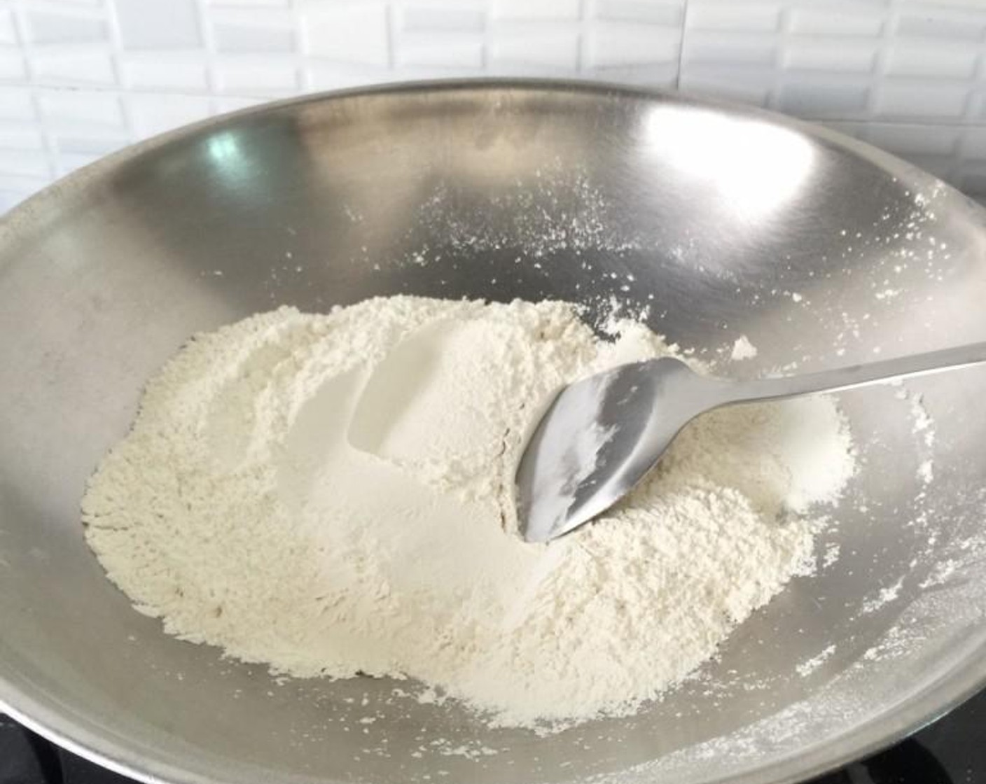 step 3 Then, lightly fry to dry roast the pre-mix Murukku Flour Mix (4 cups) in a warm wok/ frying pan over low heat till light for about 3 minutes, stirring constantly. Take care not to brown it. Otherwise the murukku will have too dark a colour and taste burnt.