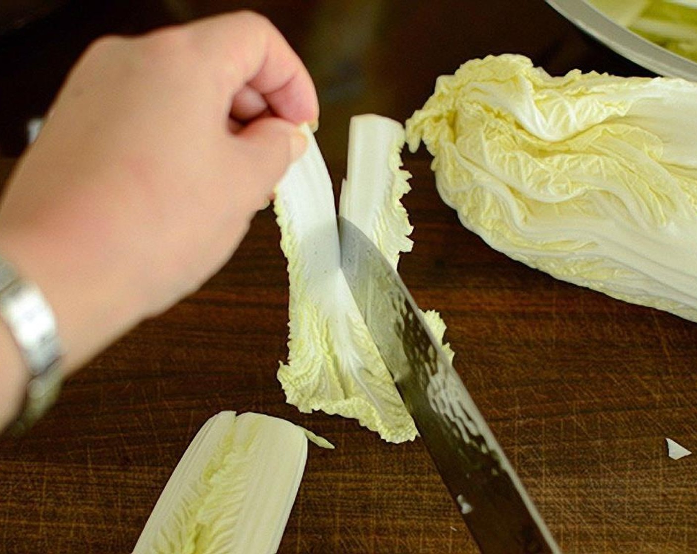 step 2 Cut each Napa Cabbage leaf in half or into 3-4 sections (depending on the size) vertically.