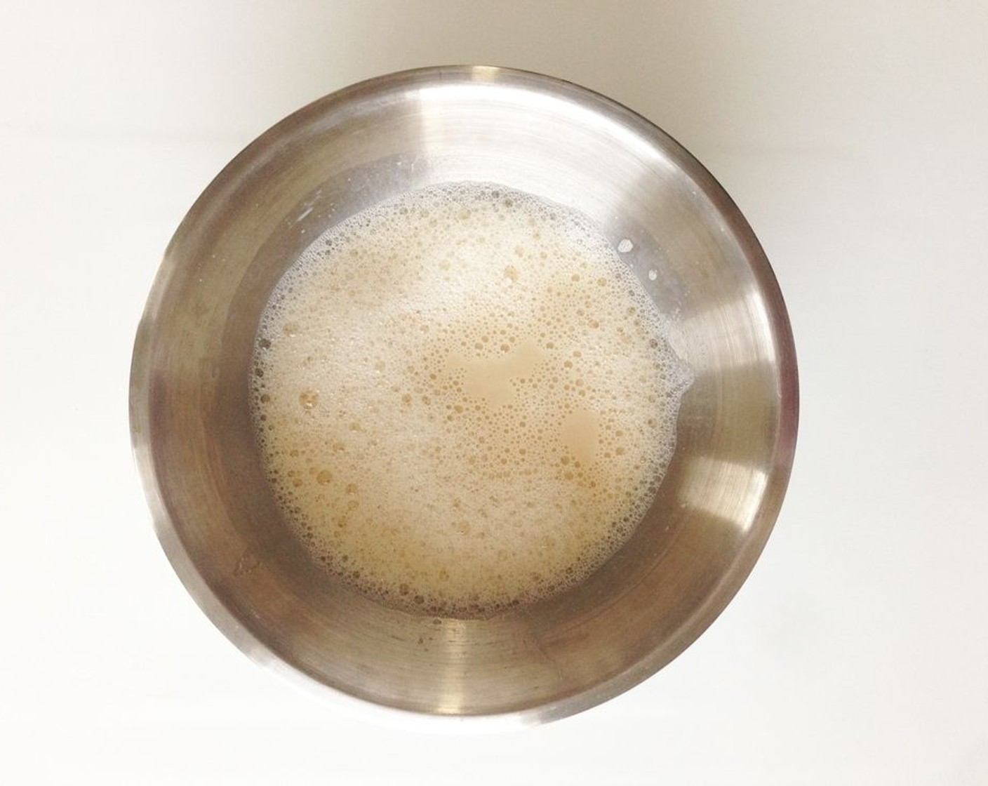 step 4 In another bowl, mix together egg whites, whole Farmhouse Eggs® Large Brown Egg (1), Low-Fat Buttermilk (2 cups), and Vanilla Extract (2 tsp).