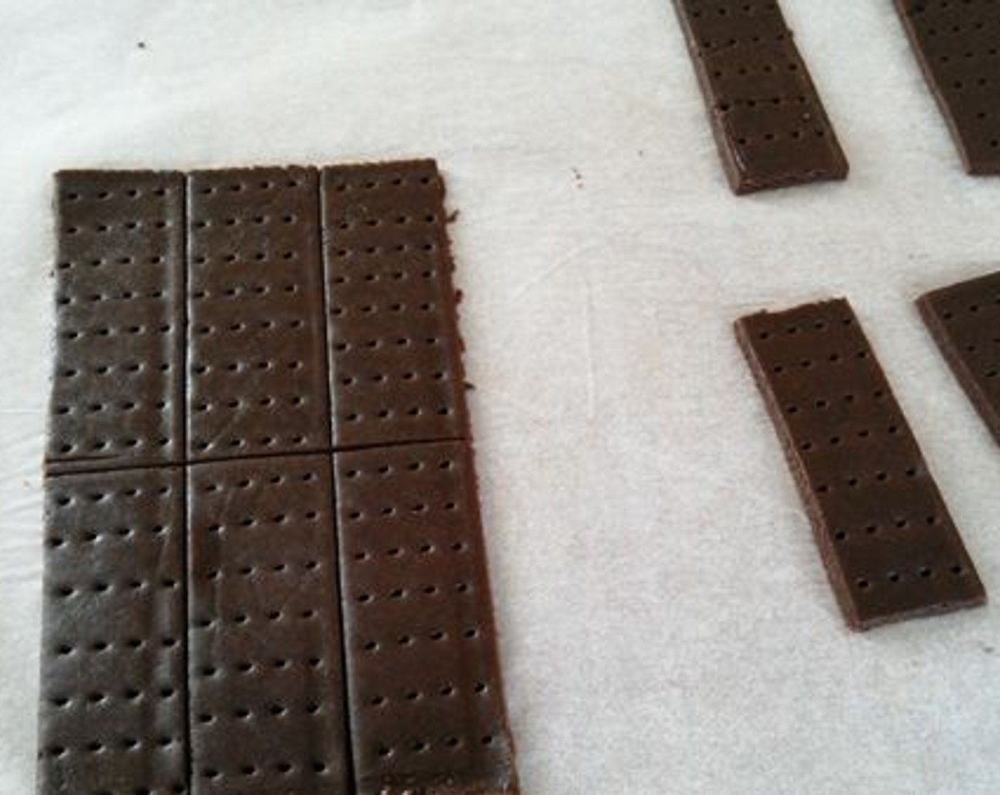 step 8 Using a fork prick on the rectangle shaped cookie dough. This is done to give it a bourbon biscuit effect.