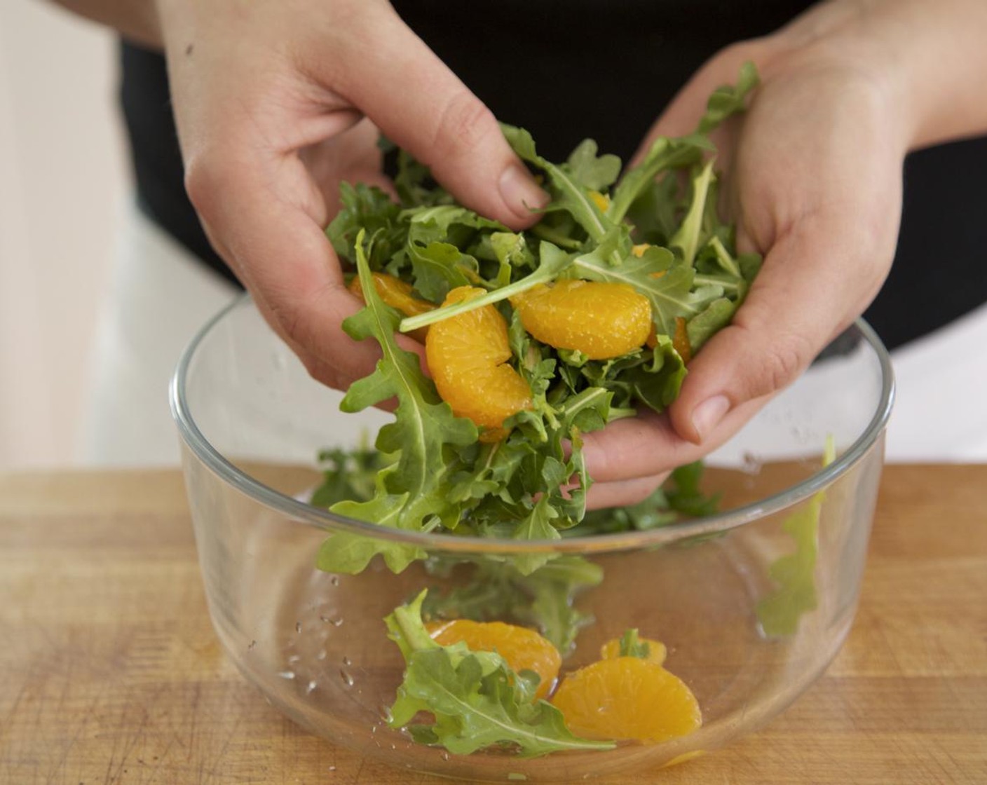 step 10 To the farro, add the potatoes, artichoke hearts and parsley. Gently stir and keep warm for plating. Drain Mandarin Orange (1/2 cup) and add to a large bowl. Add the Arugula (1 1/2 cups) and lemon juice. Toss until everything is well incorporated.