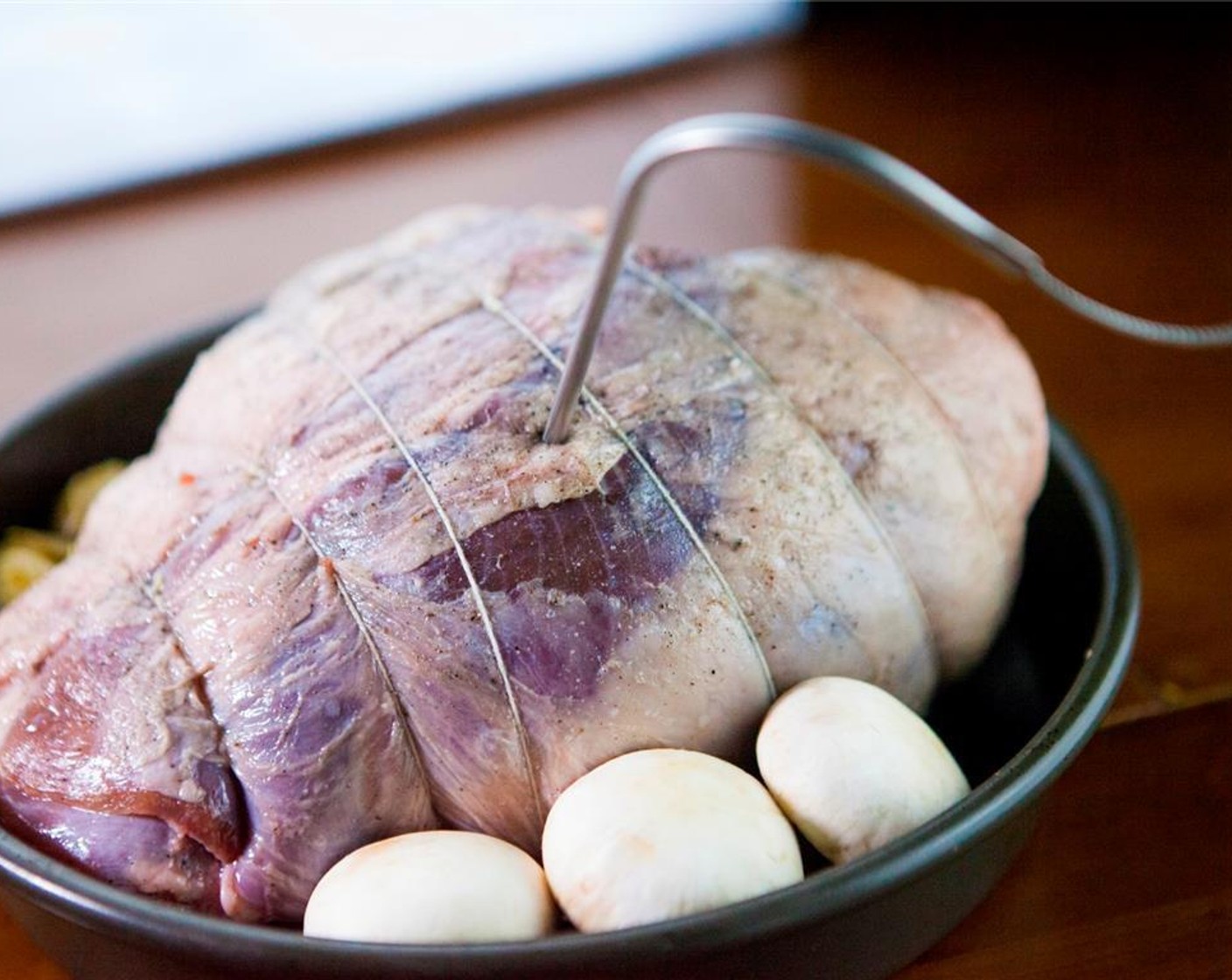 step 6 Preheat the oven to 180 degrees C (350 degrees F). Place it in a pan with Mushrooms (to taste) and Brussels Sprouts (to taste). Mix Water (1/2 cup) with Red Wine (1 cup), and then pour it on the side of the leg of lamb.