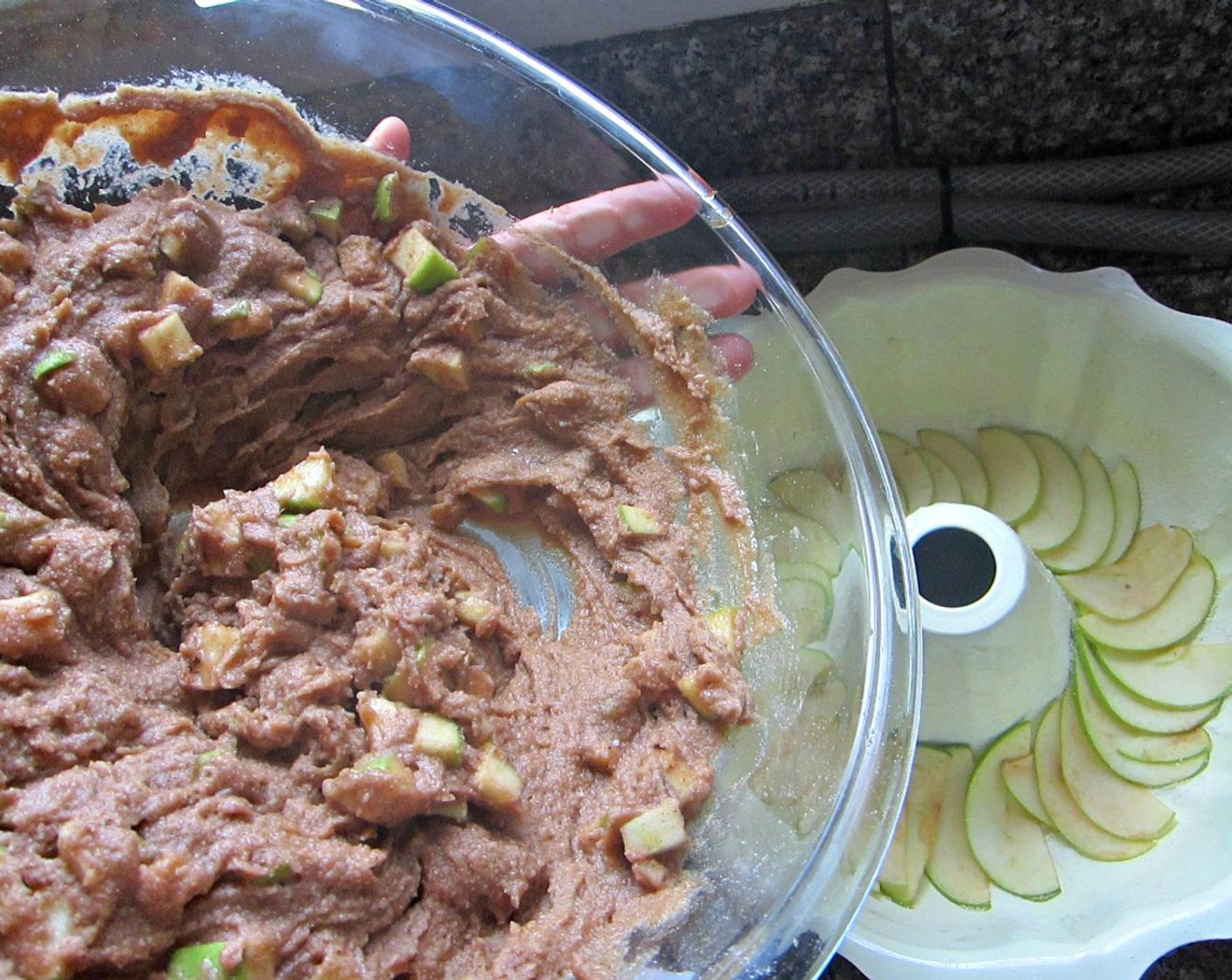 step 9 Once wet and dry ingredients are blended, add your chopped apples that have been standing by waiting for their change in the limelight. Pour batter into your prepared bundt pan, sprinkle with Brown Sugar (2 Tbsp) and smooth top of batter with the back of a spoon.