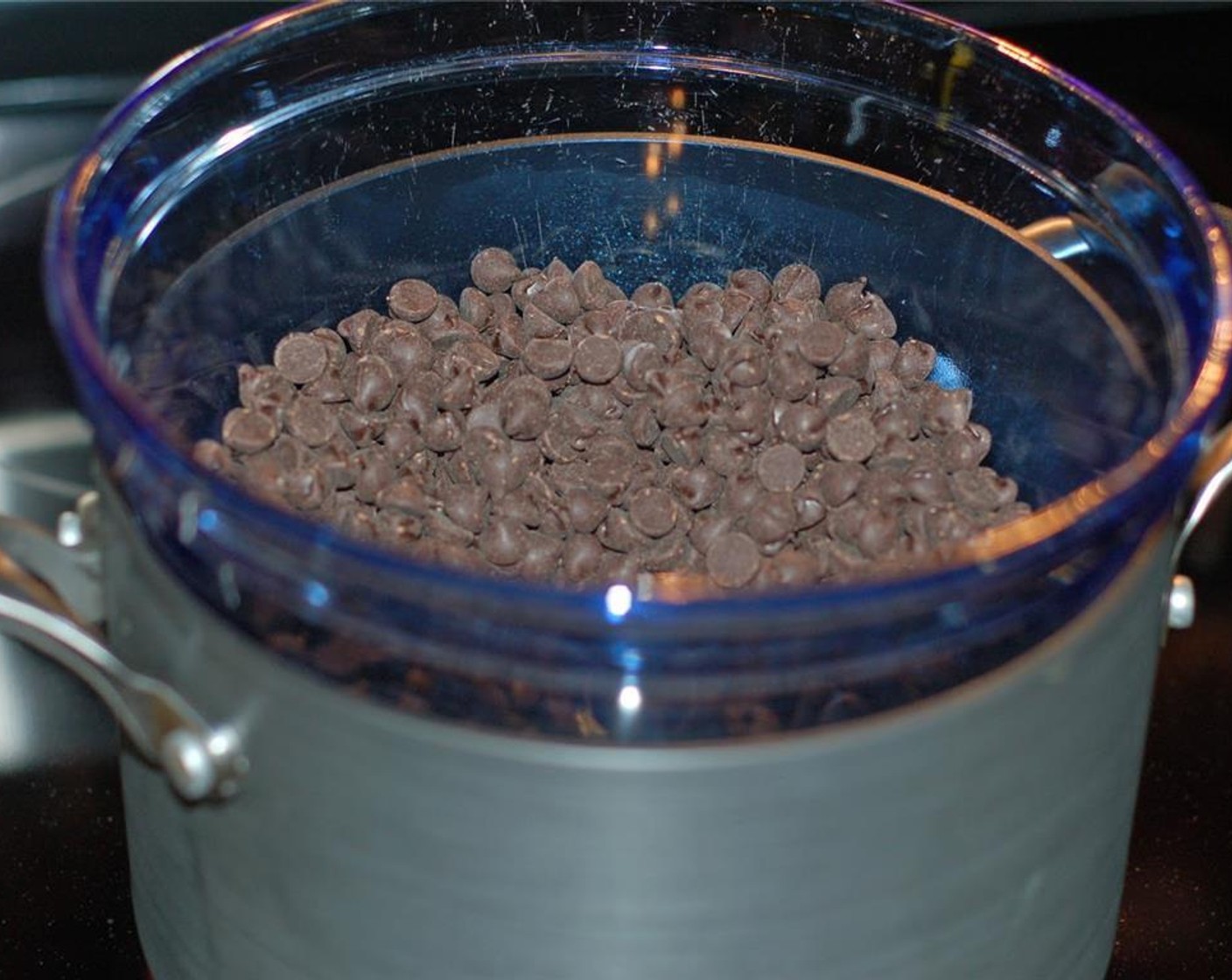 step 6 Place Dark Chocolate Chips (2 cups) in a double boiler (or a glass bowl that fits snugly over your pot) filled with water.