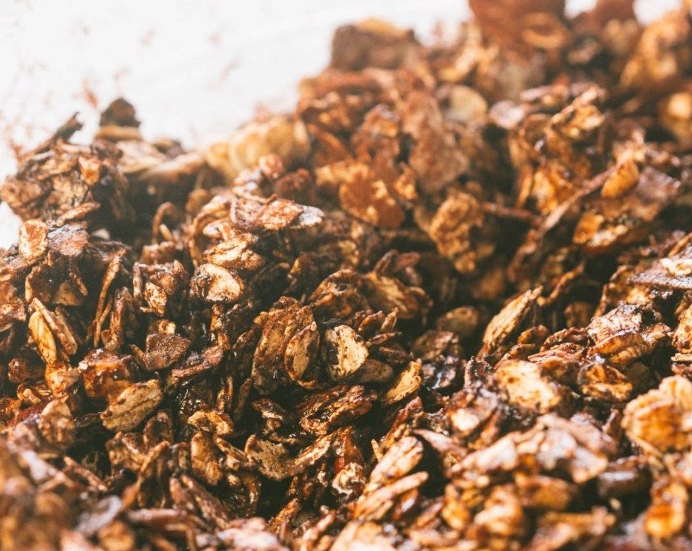 step 2 Toss the Old Fashioned Rolled Oats (2 cups), Hazelnuts (1/2 cup), Unsweetened Coconut Flakes (1/2 cup), Unsweetened Cocoa Powder (3 Tbsp), Coconut Oil (2 Tbsp), Honey (4 Tbsp), Vanilla Extract (1 tsp), Hazelnut Extract (1 tsp), and Salt (1 pinch) together until evenly coated.