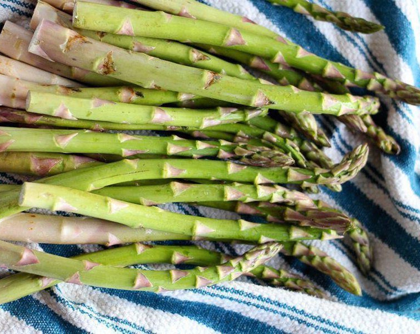 step 3 While the pasta is cooking, wash the Asparagus (3 cups) and break off the tough woody ends. You can gently bend them and they will break at the right spot. Then chop the asparagus into bite sized pieces, about 1-inch.