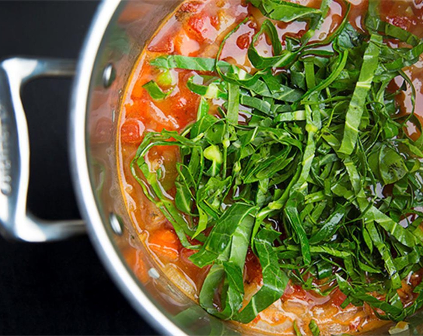 step 5 Add the Bok Choy (1 bunch), Collard Greens (1/2 bunch) or other leafy greens that you have to the pot.