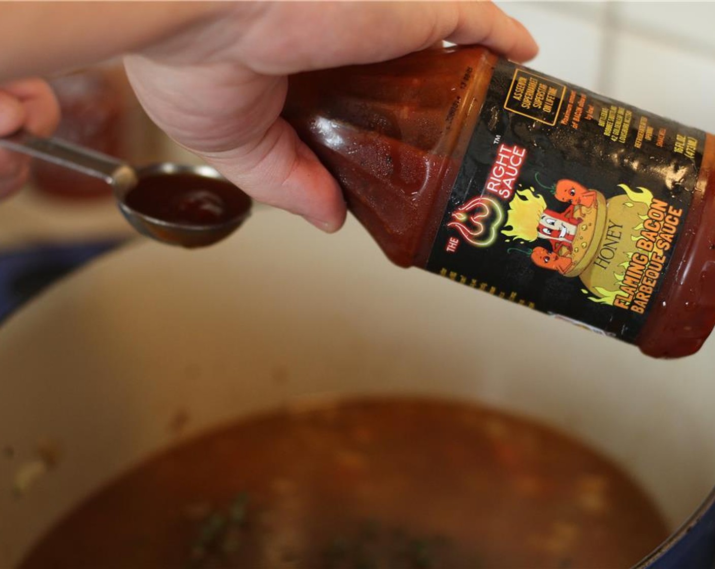 step 10 Add the Chicken Stock (4 cups) and deglaze. Use a wooden spoon to scrape the fond (all those tasty bits of flavor on the pan) loose. Then add Barbecue Sauce (4 Tbsp). Here we used Flaming Bacon Sauce.