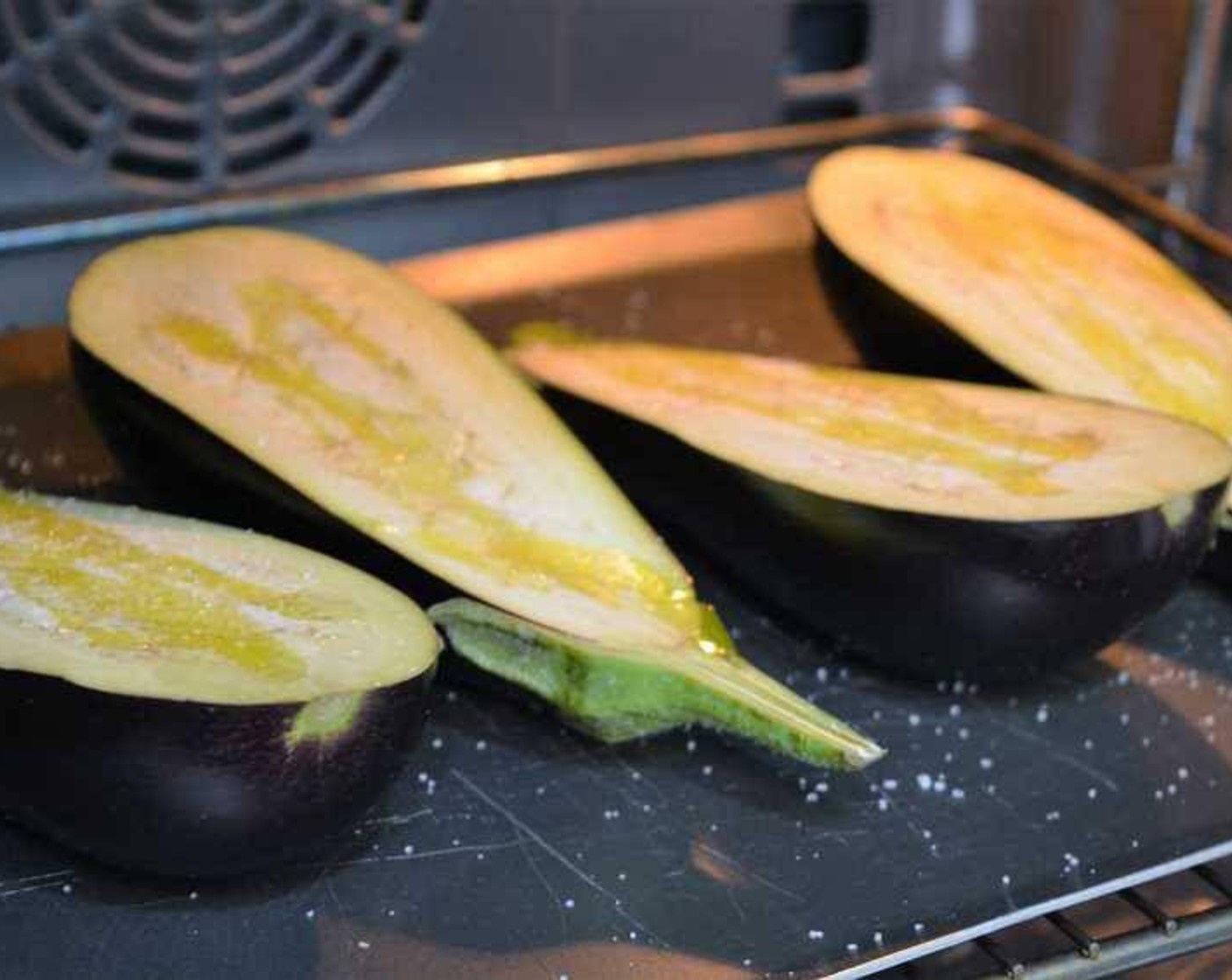 step 4 Place the eggplants in the preheated oven for 10 to 15 minutes. Monitor them every few minutes until they are well cooked in the center.