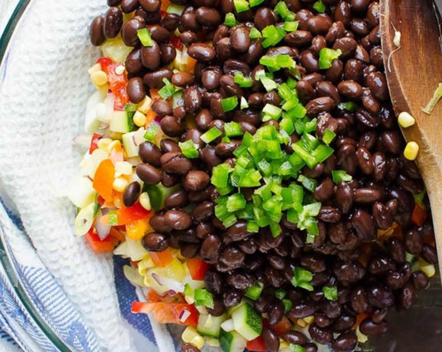 step 1 Combine Bell Pepper (1), Red Onion (1/3 cup), Zucchini (1 cup), Cucumber (1 cup), Corn (1 ear), Low-Sodium Black Beans (1 can), Jalapeño Pepper (1/2) and Fresh Cilantro (1/3 cup). Toss to combine.